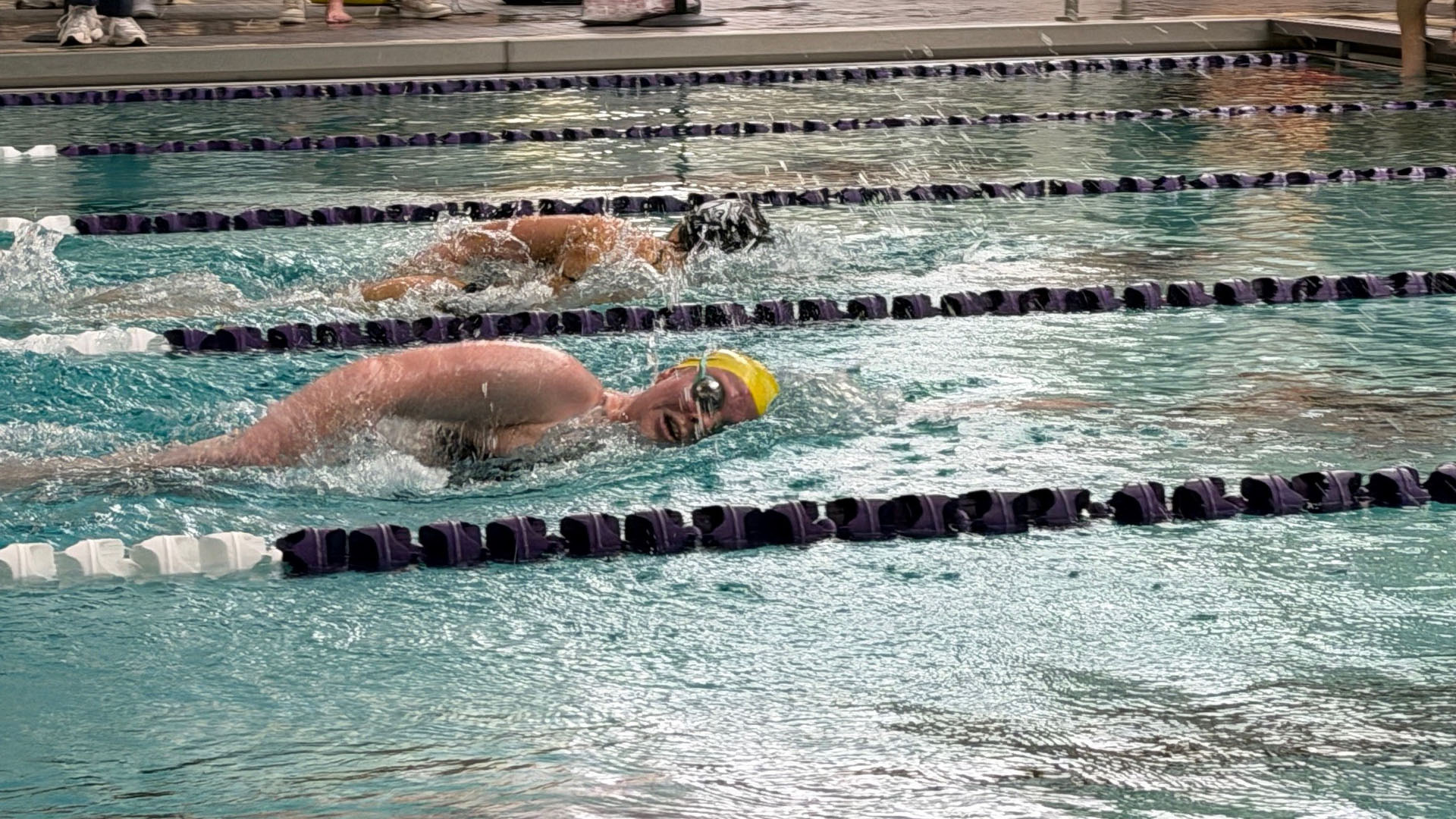 A female swimmer for West Chester swims a freestyle event against Lehigh at Graham Natatorium