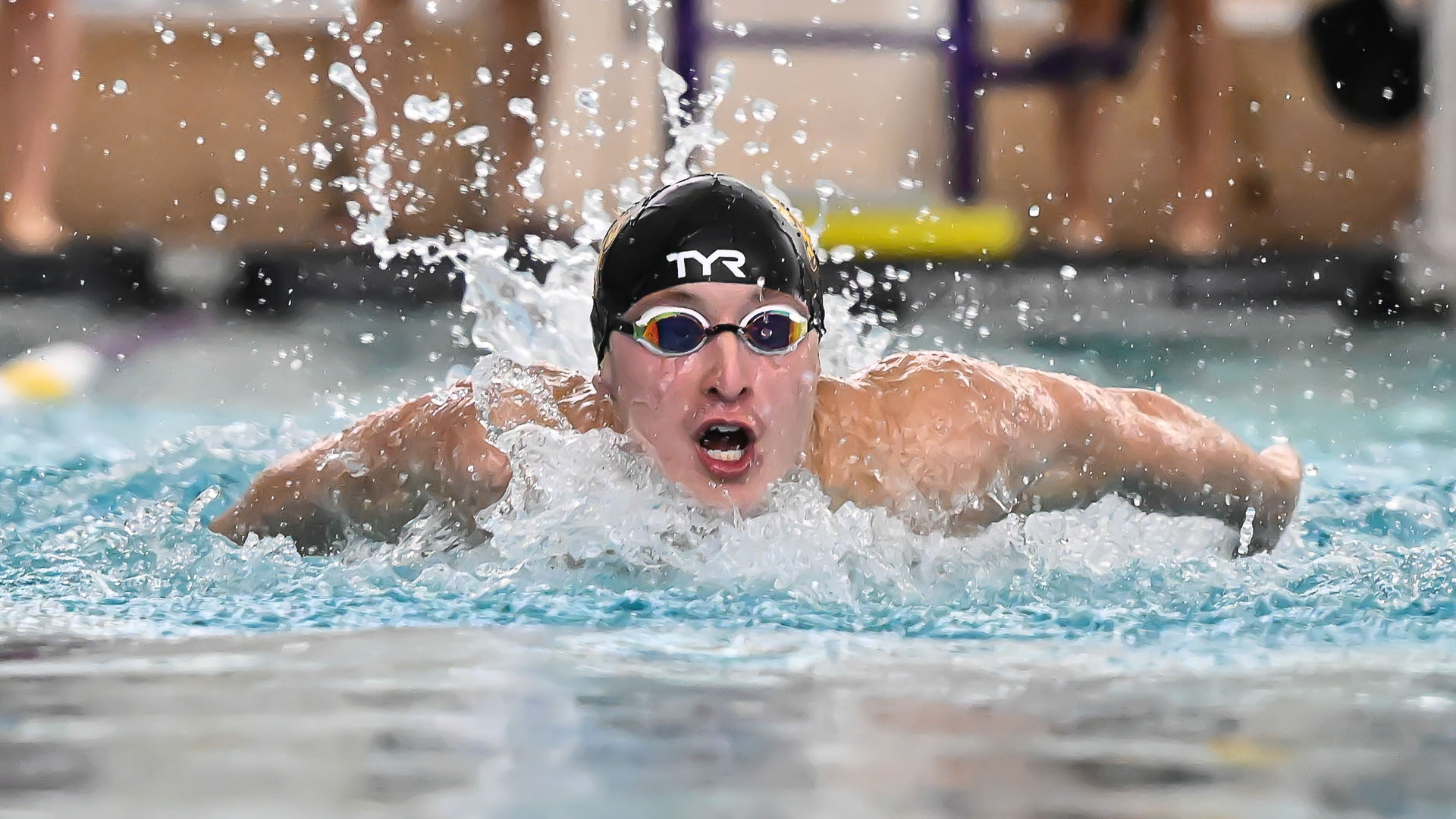 Men's Swimmer swims the butterfly against Salisbury