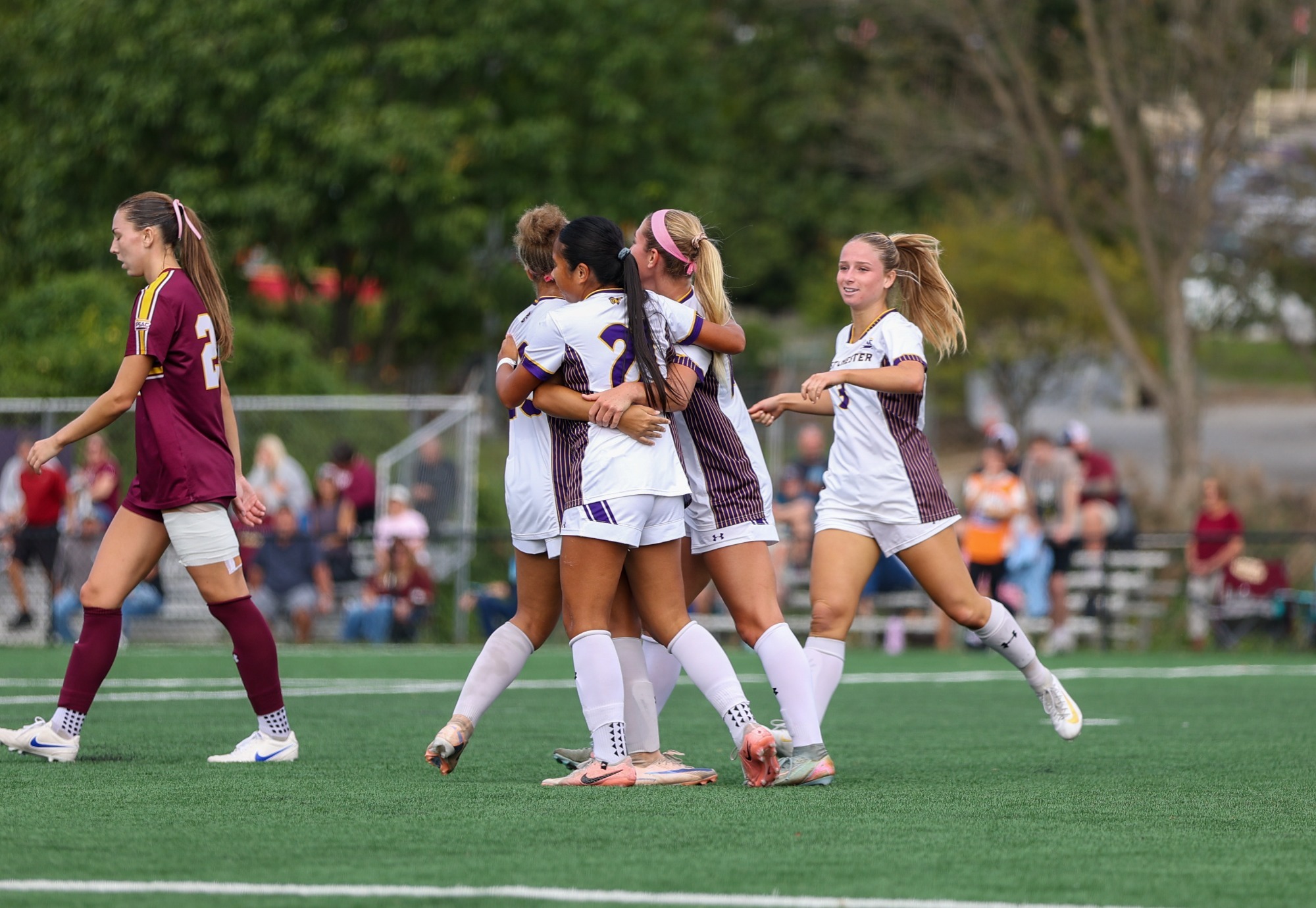 WOMEN'S SOCCER PLAYERS NGUYEN, BARBER, AND RYDER CELEBRATING FOLLOWING JORDAN NGUYEN'S FIRST HALF GOAL