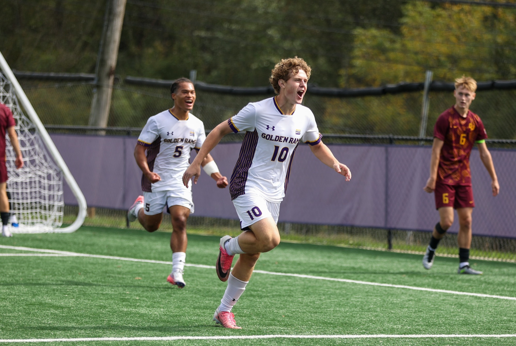 Cannon Dalton wearing home on white kit yells as he Celebrates his first collegiate goal vs Gannon