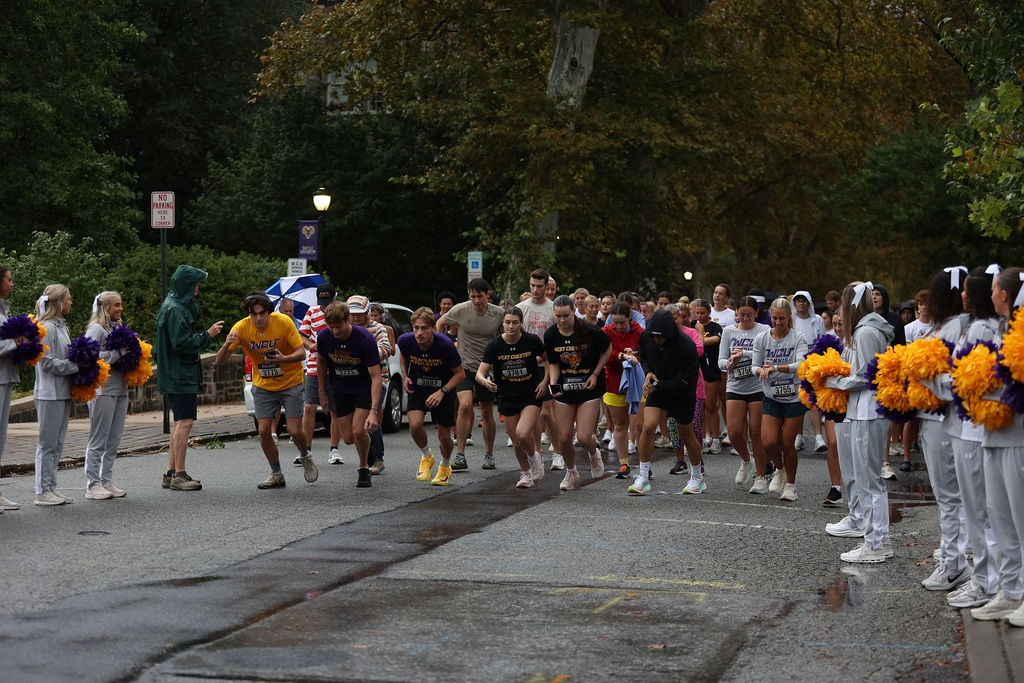 RUNNERS AT START LINE FLANKED BY WCU CHEER TEAM ON CHURCH STREET IN WEST CHESTER FOR RAMS LETS WALK 5K ON SUNDAY, SEPTEMBER 20