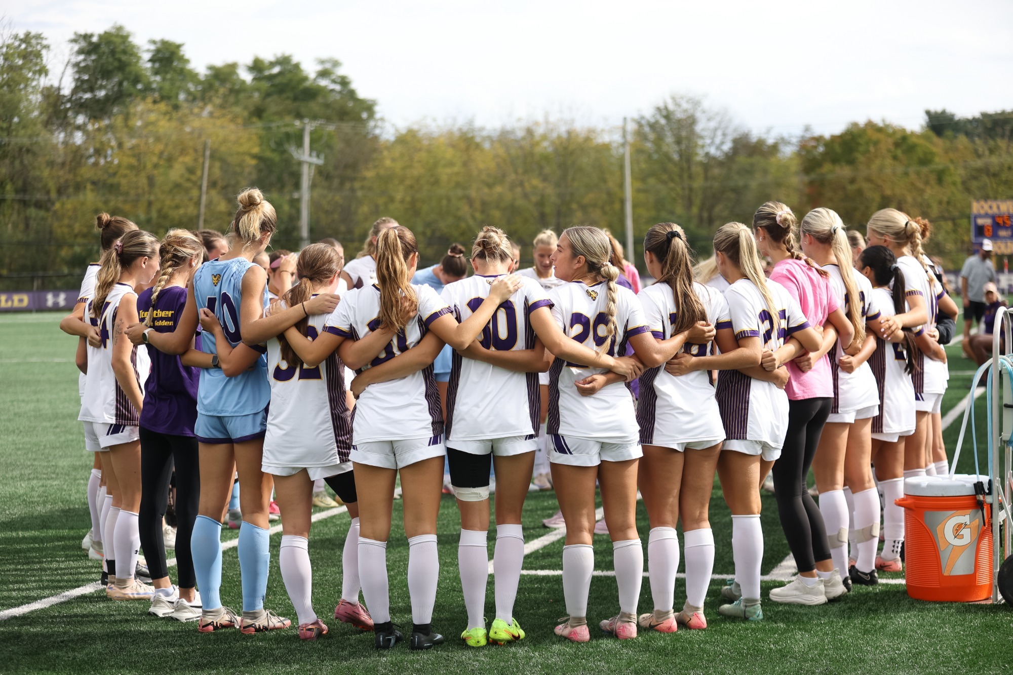 WOMEN'S SOCCER WEARING HOME WHITE ON WHITE KIT IN HUDDLE AT HALFTIME OF GAME VS BLOOMSBURG ON 10/3/26