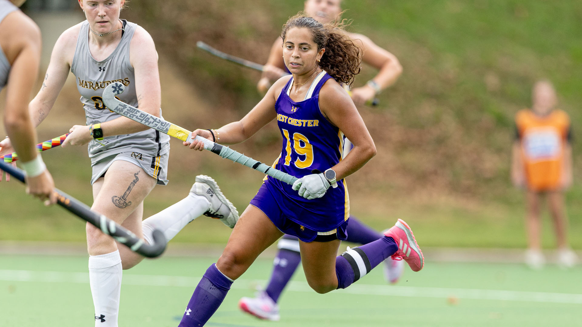 Allison Patel chases down a loose ball at home in her purple uniform against Millersville