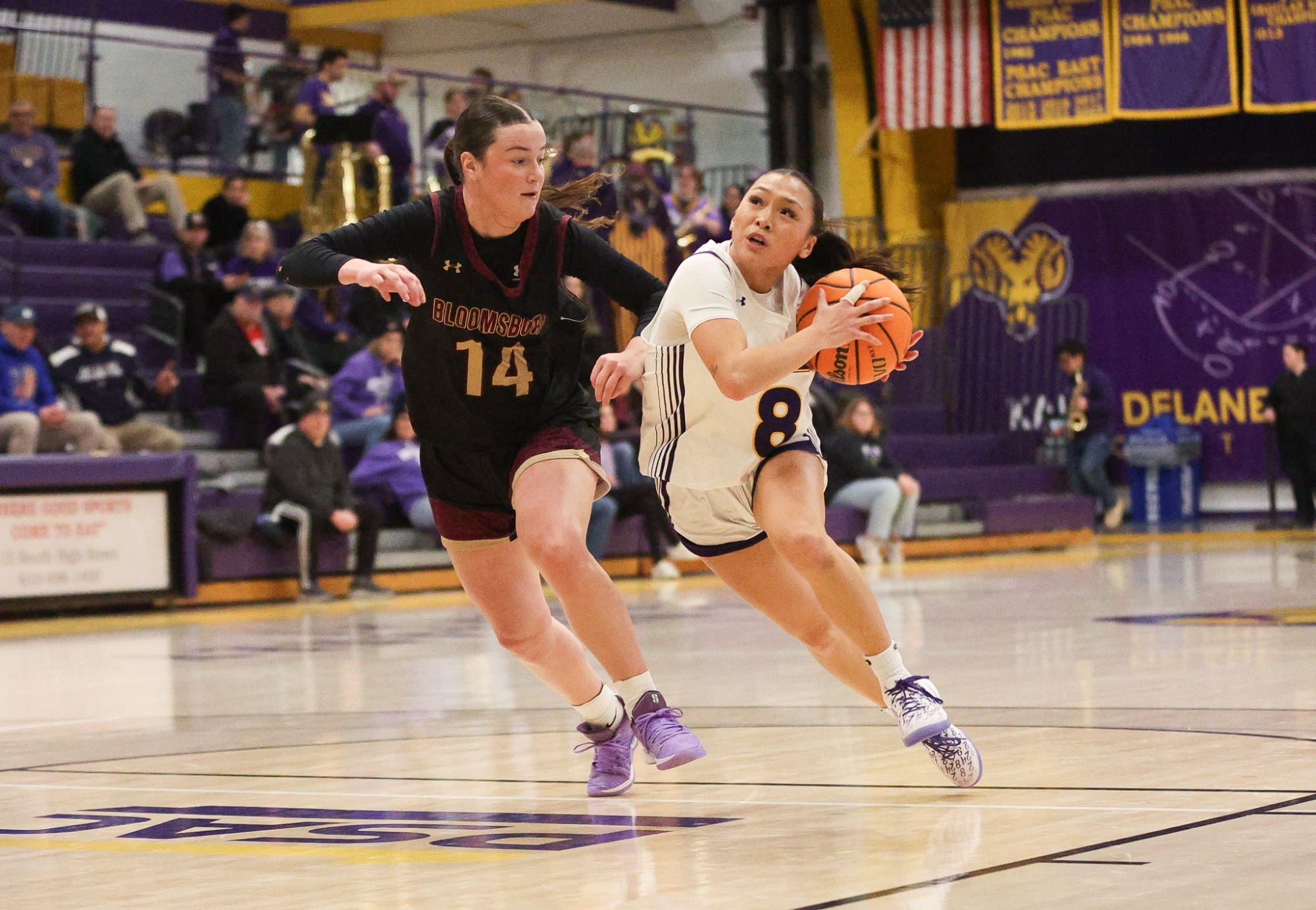 Sayson drives the lane vs a Bloomsburg defender 2-11-26