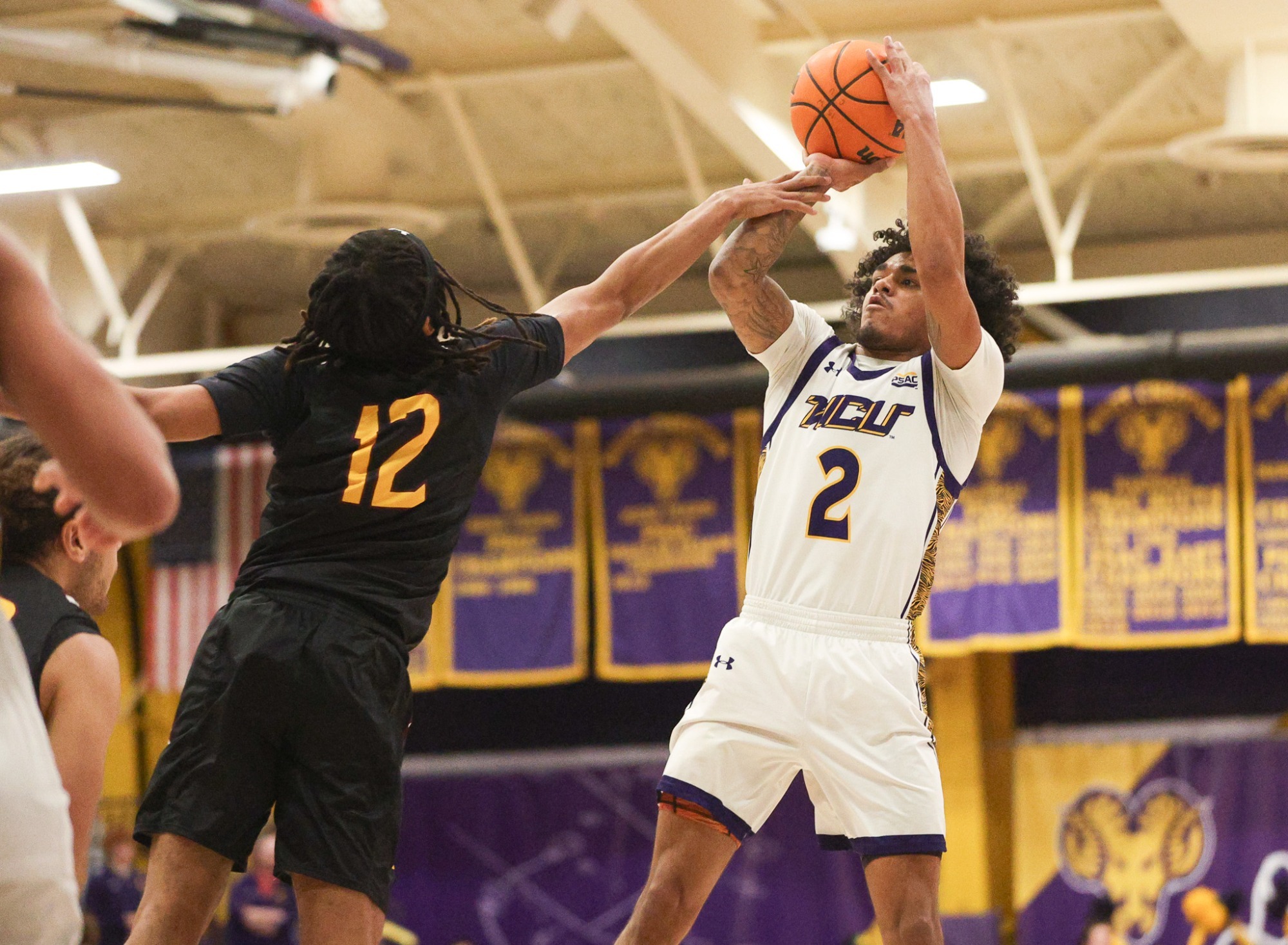 Ruben Rodriguez Jr. shoots over a Bloomsburg defender on 2-11-26