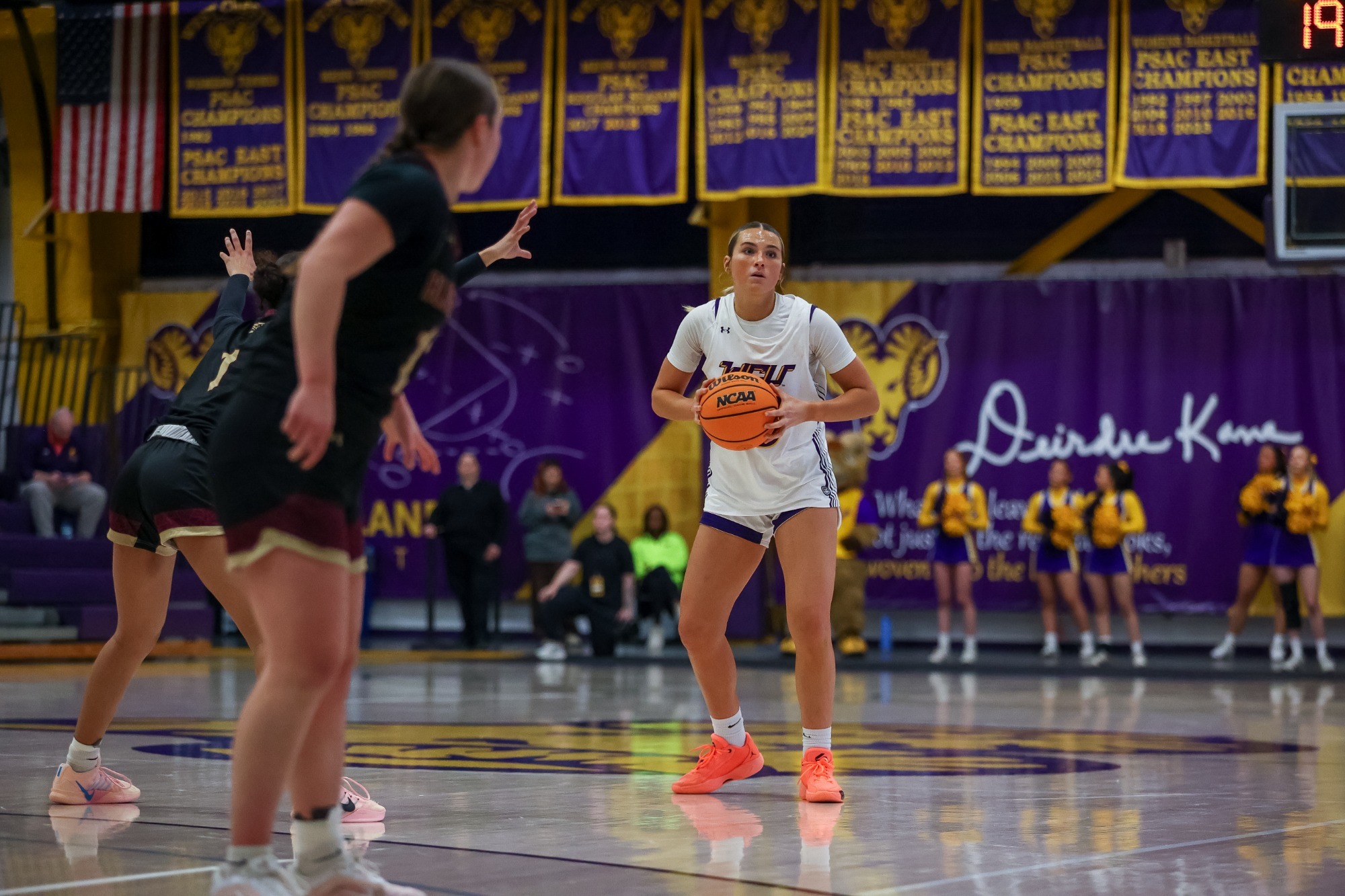 Erin Daley looks to pass the basketball at home vs Bloomsburg on 2-11-26