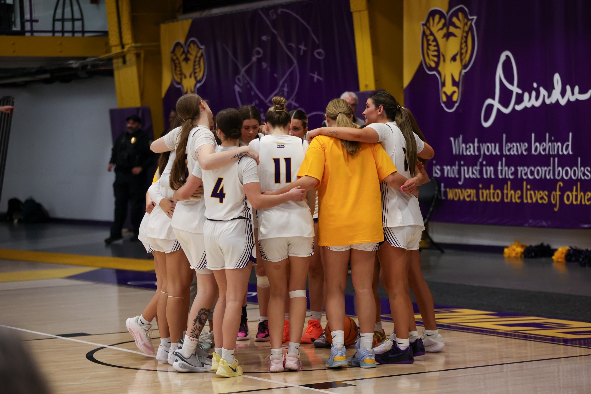 2025-26 WOMEN'S BASKETBALL TEAM IN HUDDLE IN LANE PRIOR TO GAME VS ESU ON 2-28-26