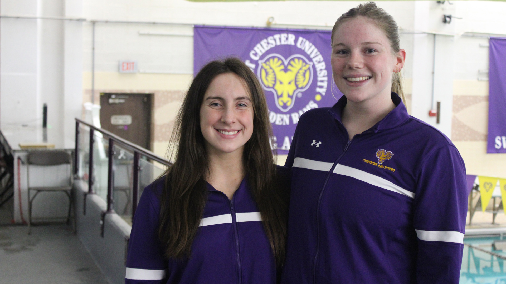 Lenya Ryan and Greta Saville pose for a photo together on the deck of Graham Natatorium 