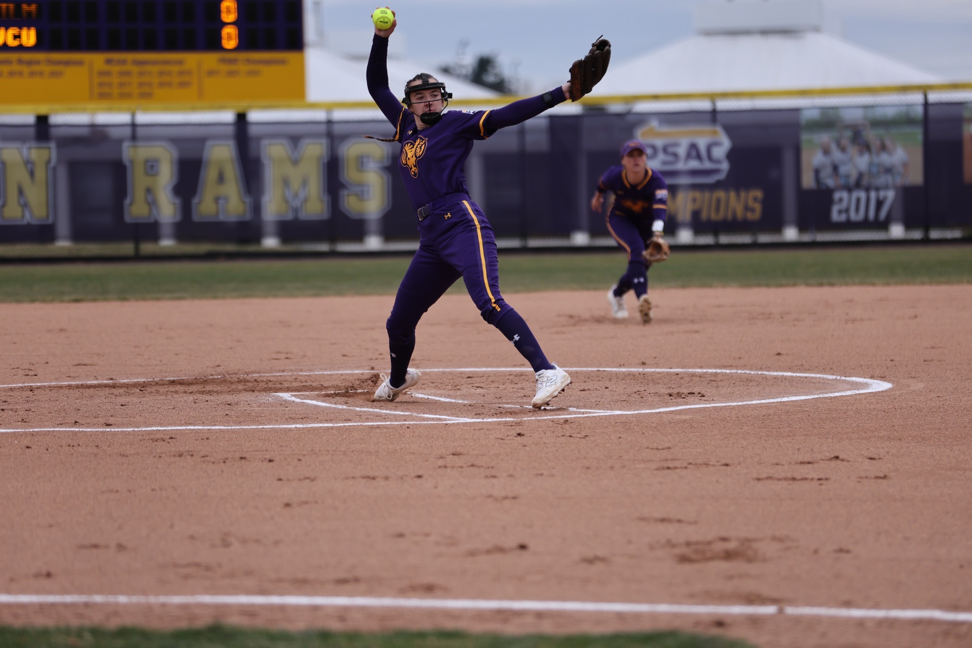Danielle Ciliberto pitching vs Wilmington in new purple uniforms with ram head on 3-15-26