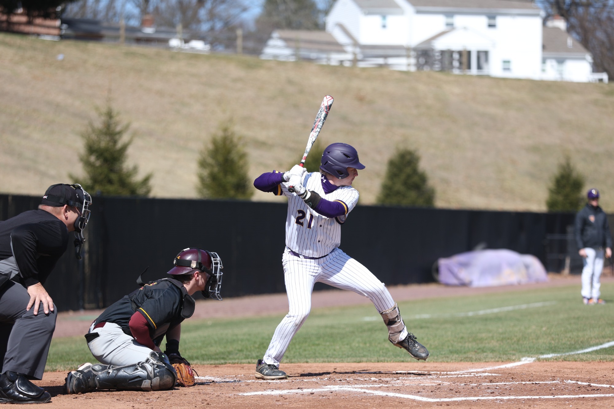 Andrew Kell wearing home white pinstripes batting vs Gannon on 3-14-26 