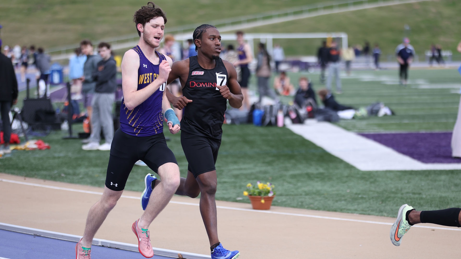Eli Radio runs the 1500 at Purple and Gold Opener wearing purple racing top and black shorts