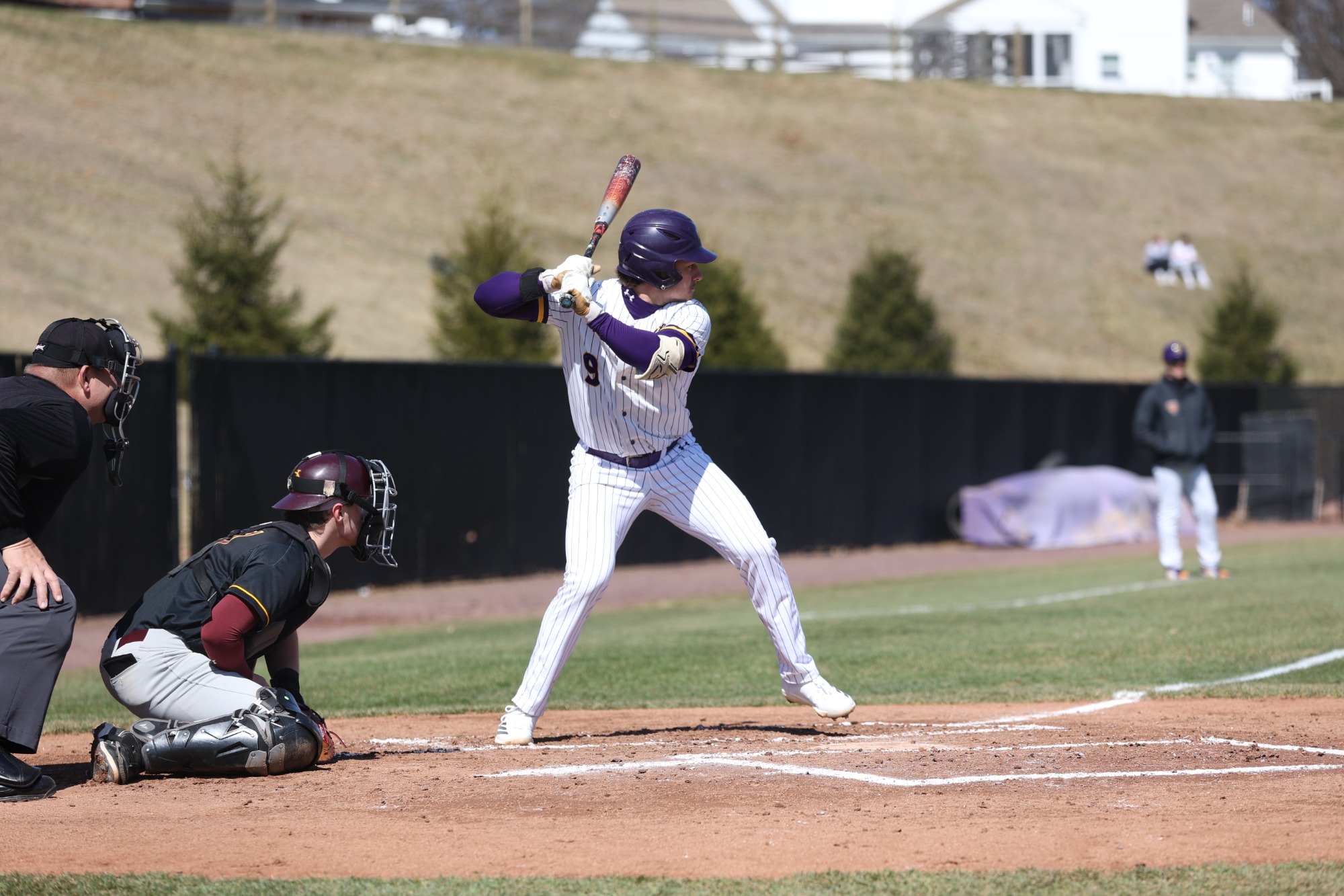 Patrick Gozdan batting at home vs Gannon wearing white pinstripe 