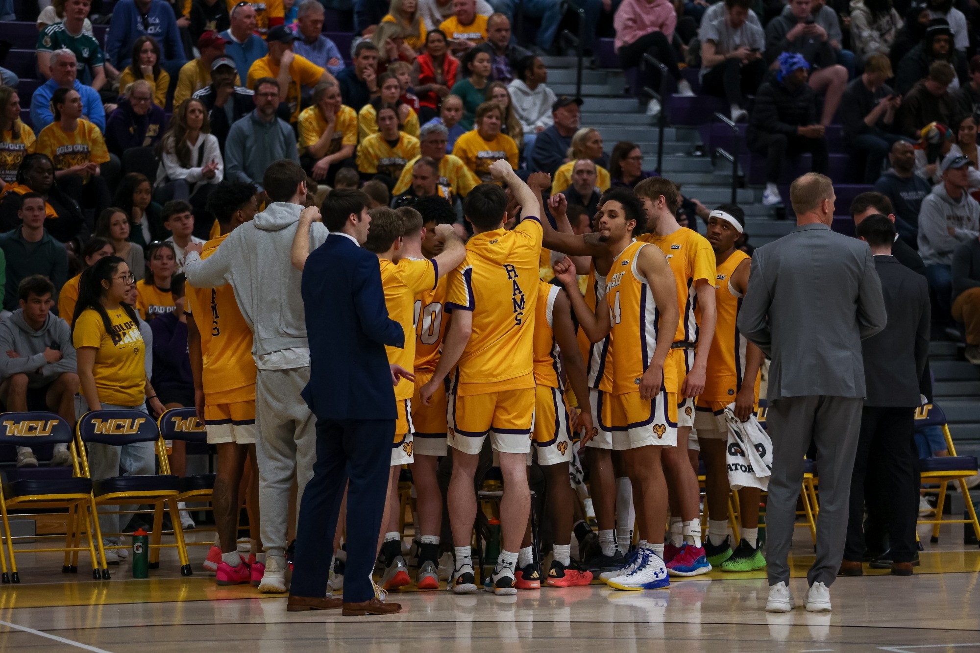 WCU Men's Basketball team huddle in front of home crowd during senior day win over ESU on 2-28-26
