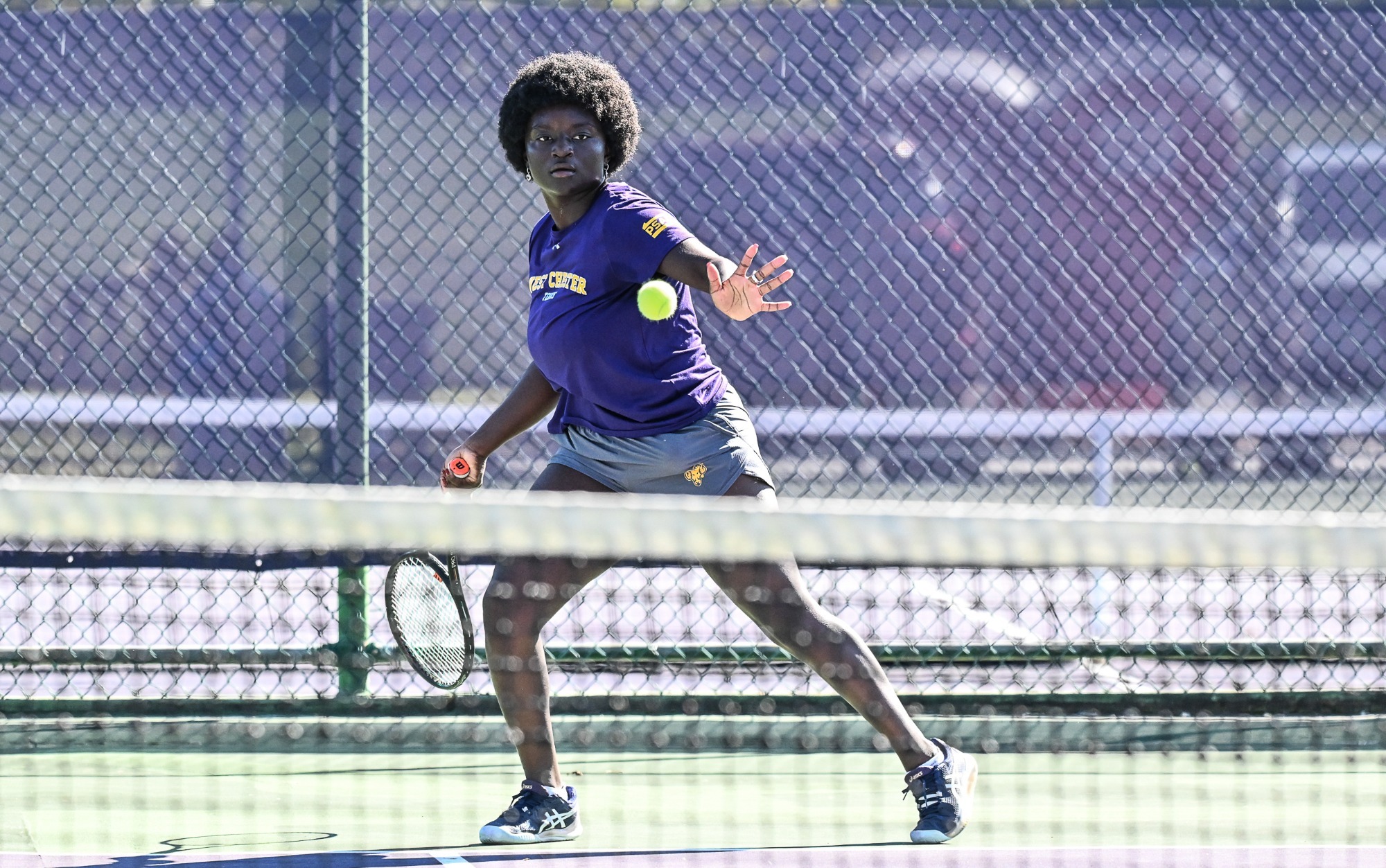 Felicia Manful playing tennis vs STAC on 10/21