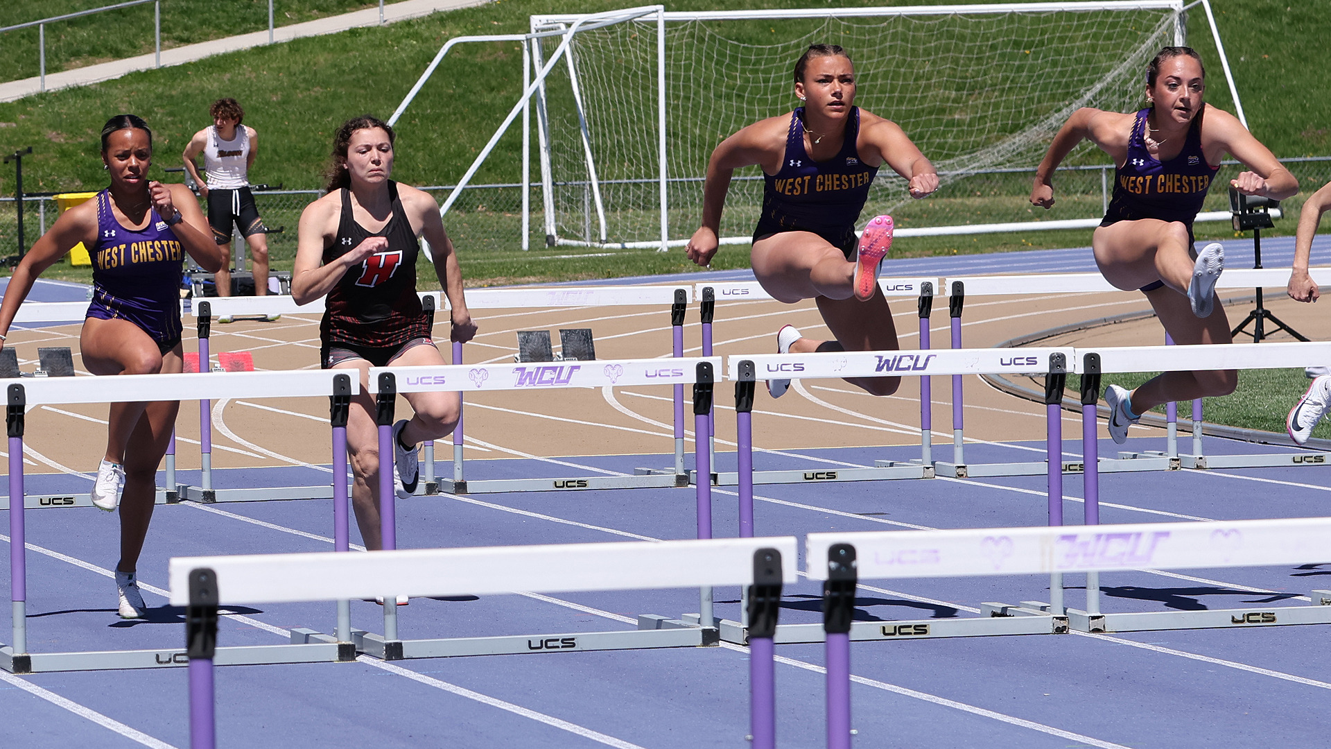 Morgan Pera and Leah Wasko compete in the finals of the 100m hurdles at Farrell Stadium