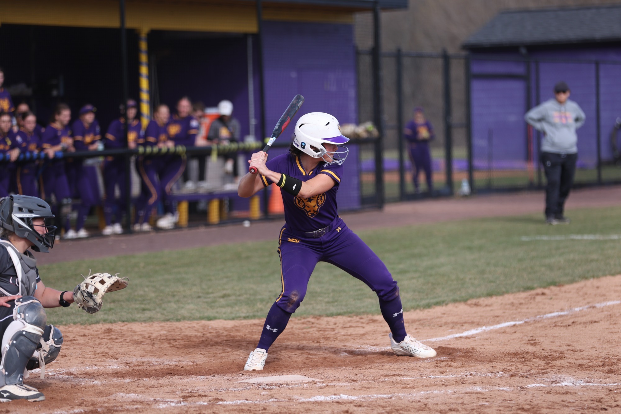 Kayla Fitzpatrick batting vs LHU wearing new all purple uniforms