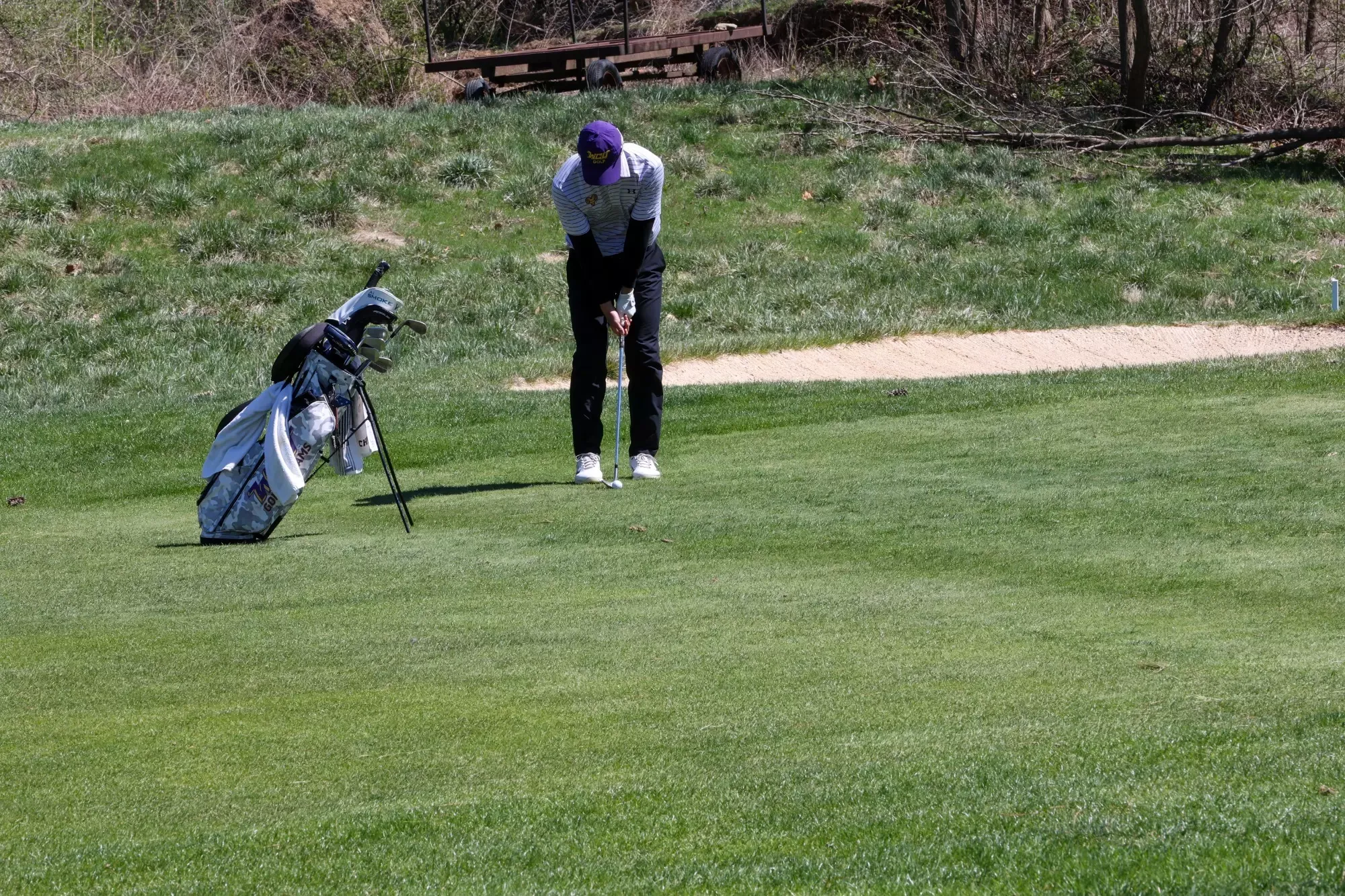 Yamato Kimura lines up a chip from just off the green on the first hole at Penn Oaks during the Dr. Edwin B. Cottrell Invitational