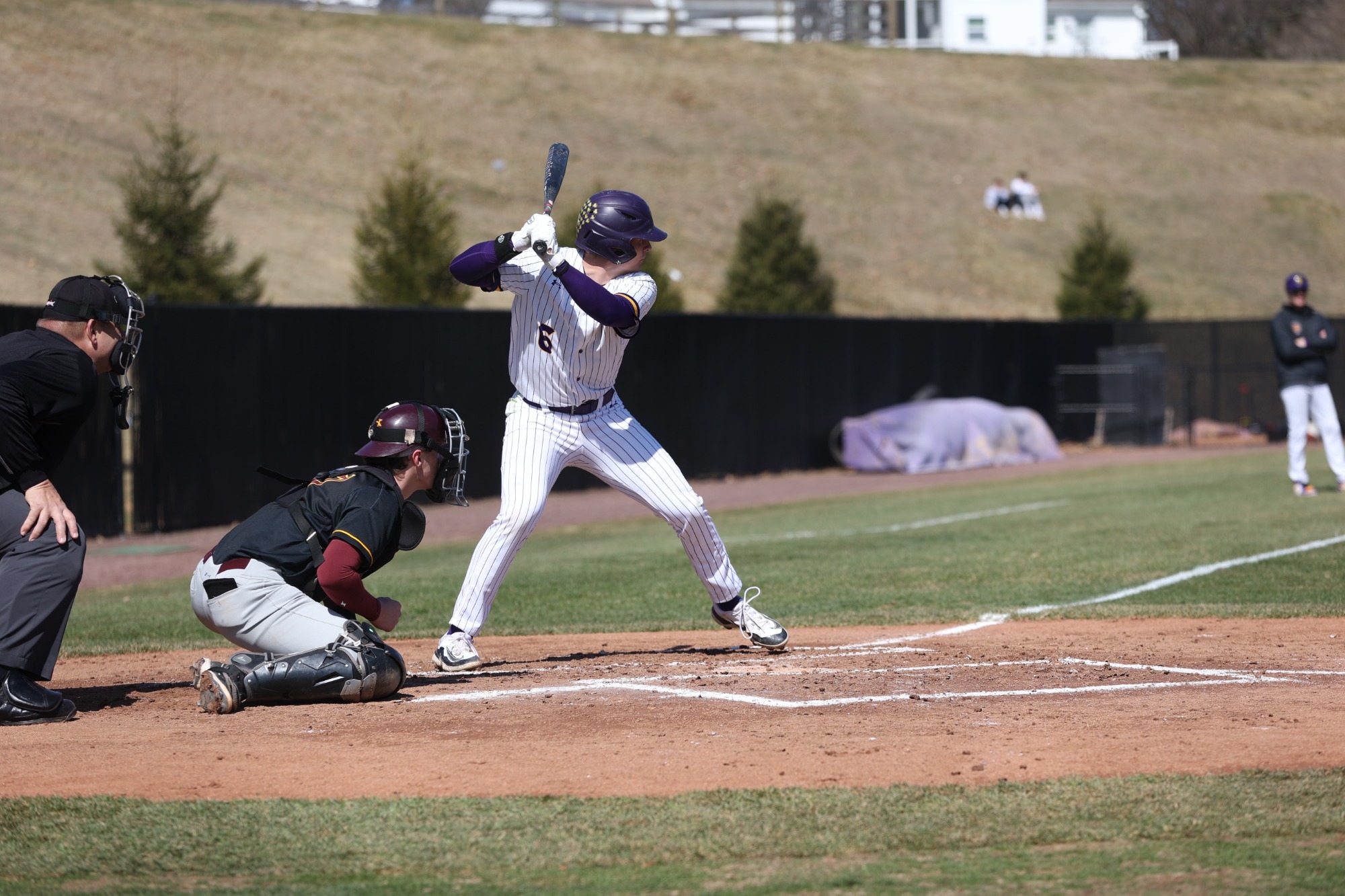 Drew Simpson batting wearing home white pinstripes vs Gannon on 3/14