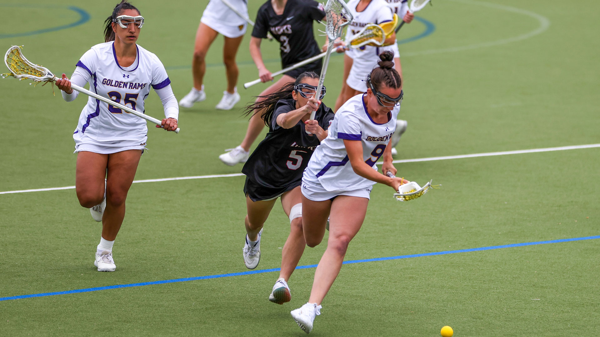 Caitlin Trickett in all white home uniform chases down a loose ball for a ground ball on Tuesday vs IUP in PSAC Quarterfinals