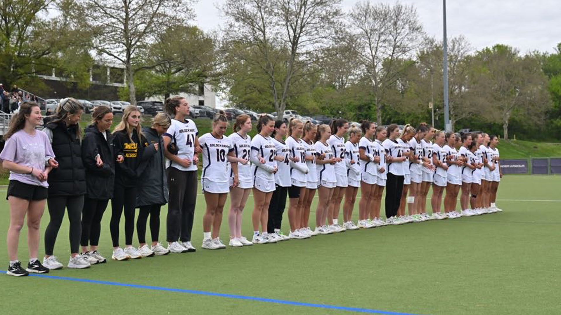 West Chester lined up in the middle of the field for the playing of the national anthem at Vonnie Gros Field