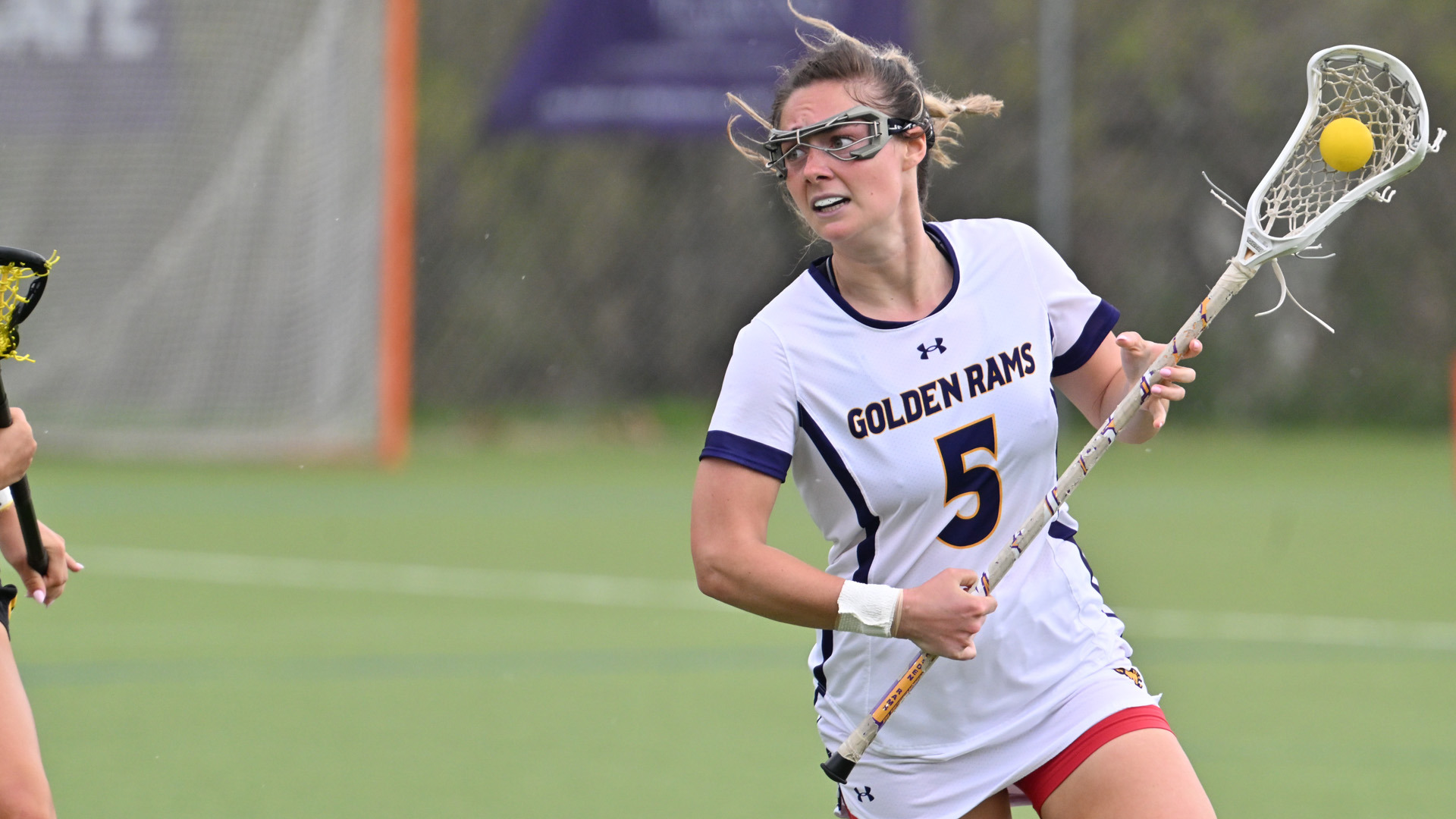 Kara Stewart clears the ball with a Millersville defender chasing her at Vonnie Gros Field.
