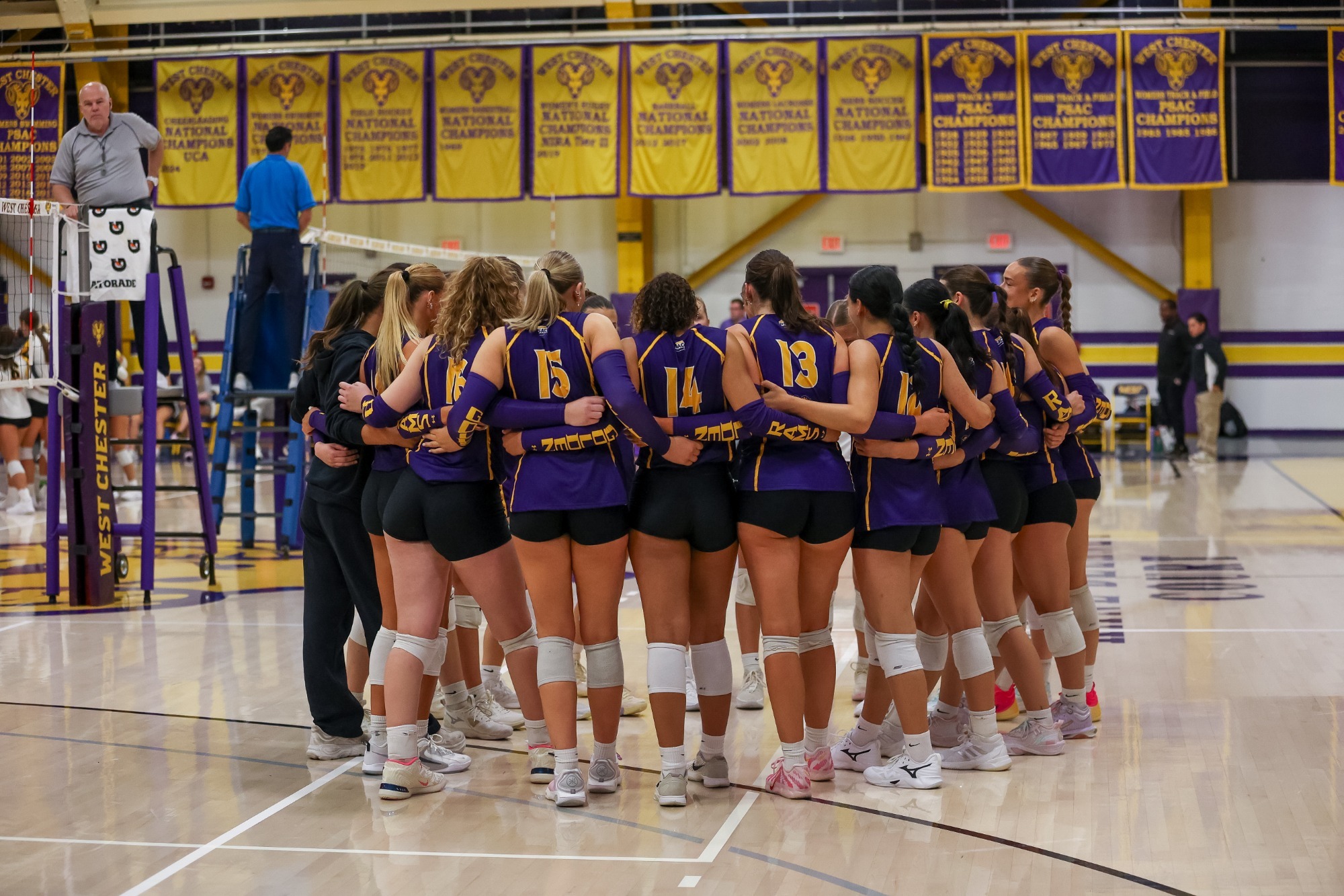 FULL 2026 WEST CHESTER VOLLEYBALL TEAM ON COURT PRIOR TO THE GAME VS WEST VIRGINIA STATE ON SATURDAY AFTERNOON. GOLDEN RAMS WEARING PURPLE SLEEVELESS JERSEYS WITH GOLD PIPING