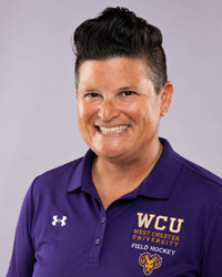 Amy Cohen head shot 2026 in a purple polo shirt
