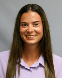 Madison Melvin head shot in purple blouse