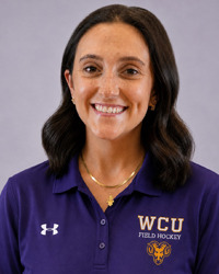 Dara Spavlik head shot in purple polo