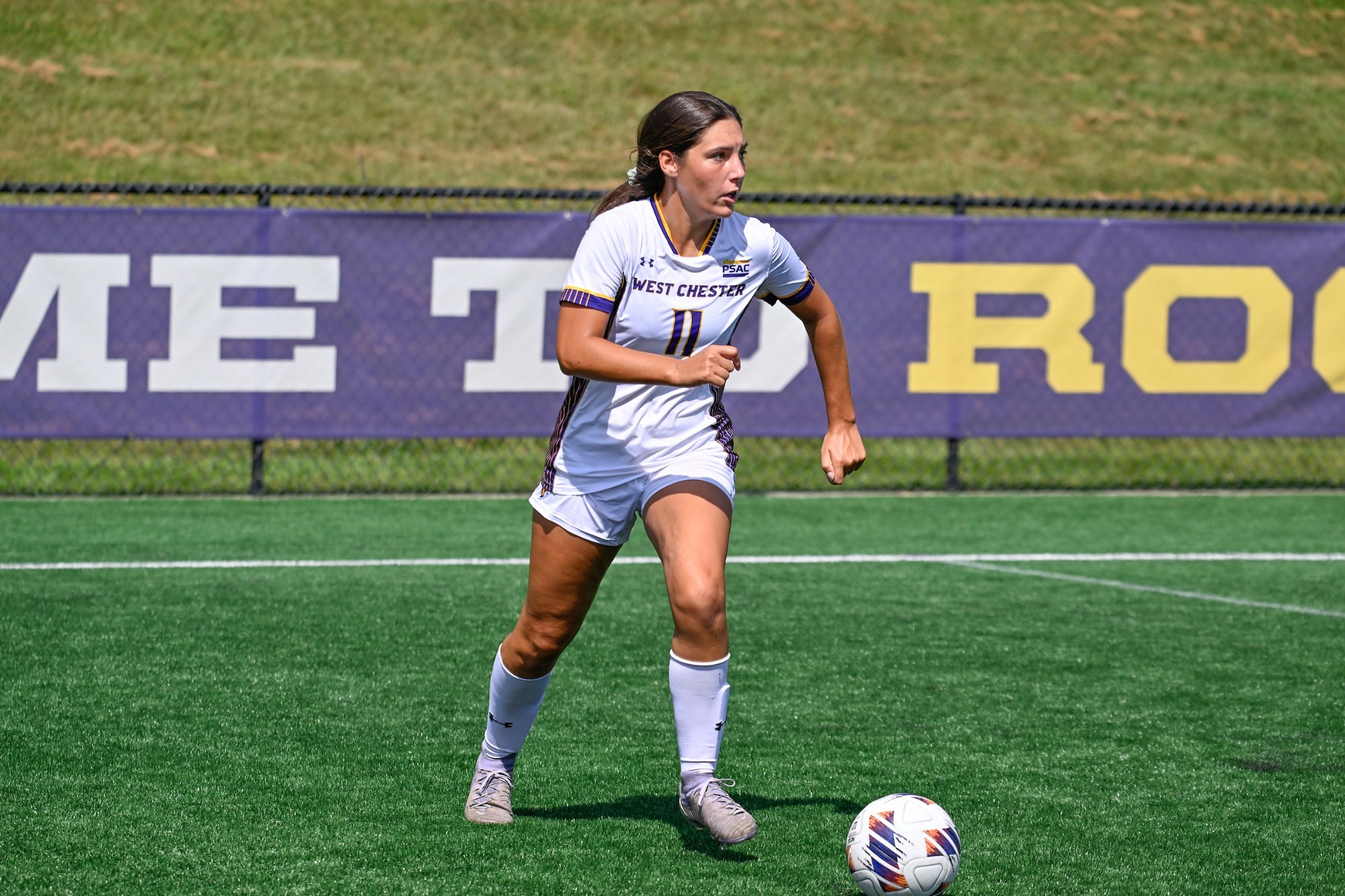 MADDIE MOSIER WEARING HOME WHITE ON WHITE KIT BRINGS THE BALL UP FIELD VS MANSFIELD ON SATURDAY AFTERNOON
