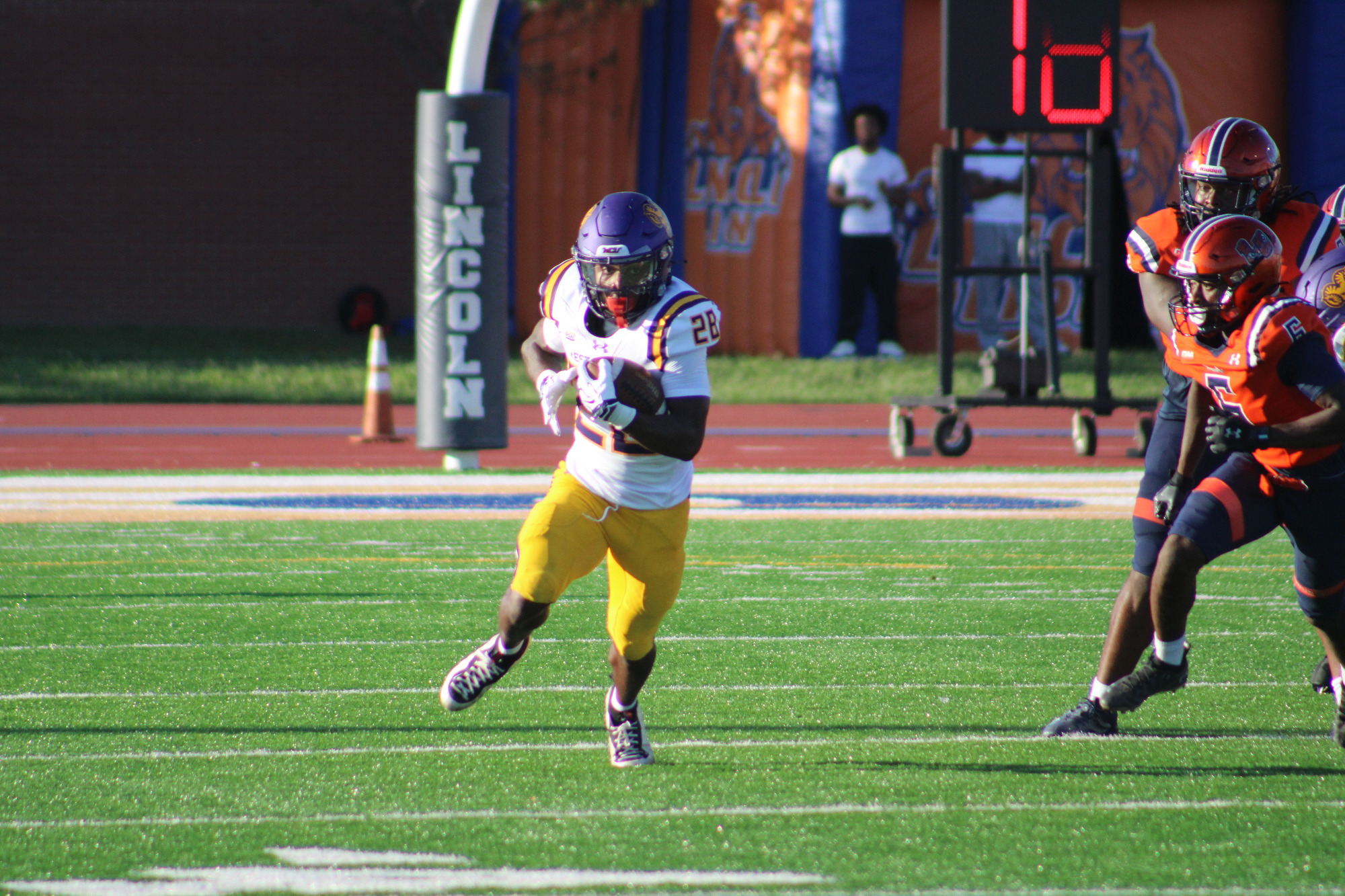 Mic Johnson races around the end and down the sideline against Lincoln