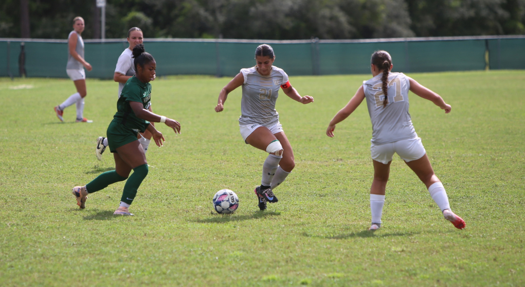 Ariana Suarez kicking the soccer ball
