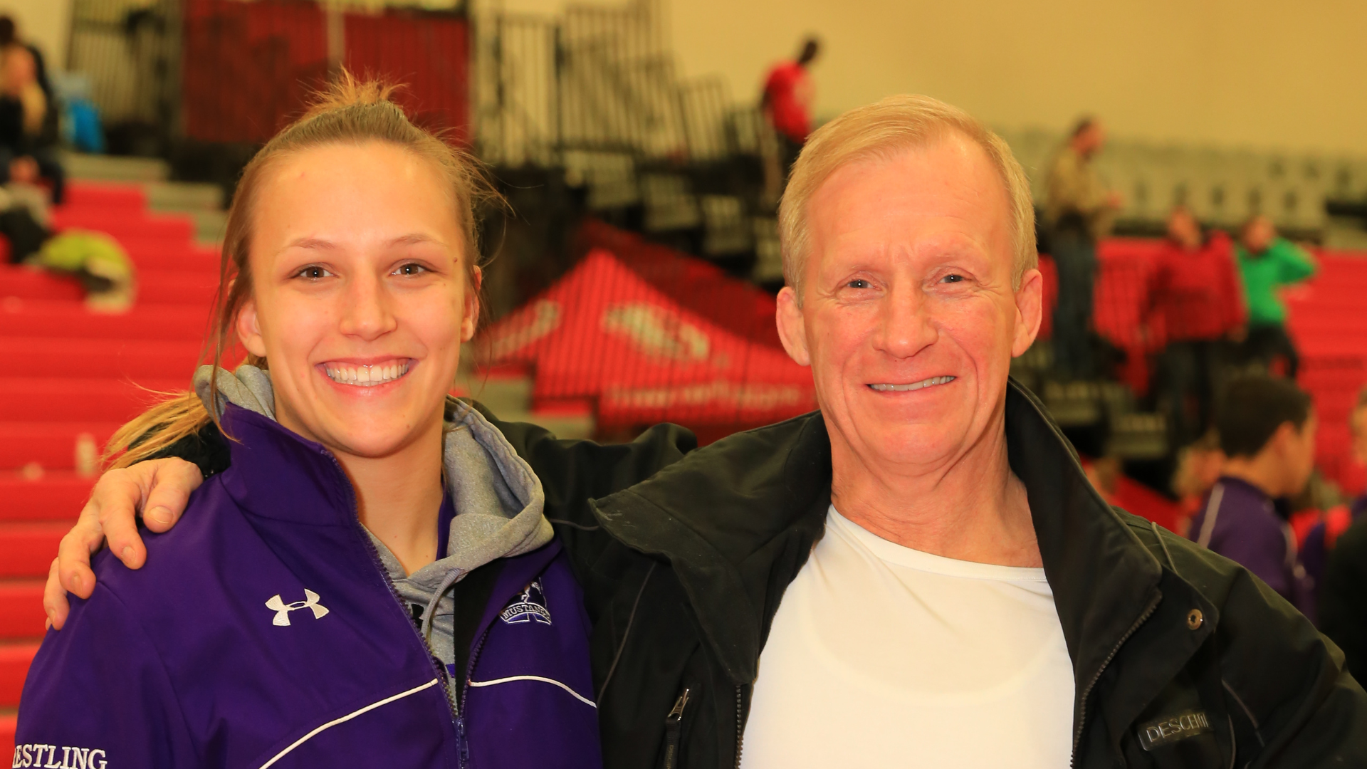 Mike and Brianne Barry, former Mustang Wrestlers - smiling, head and shoulder shot