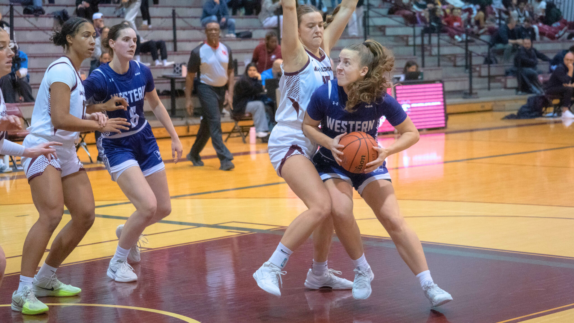 Emily Capretta plays the ball against McMaster