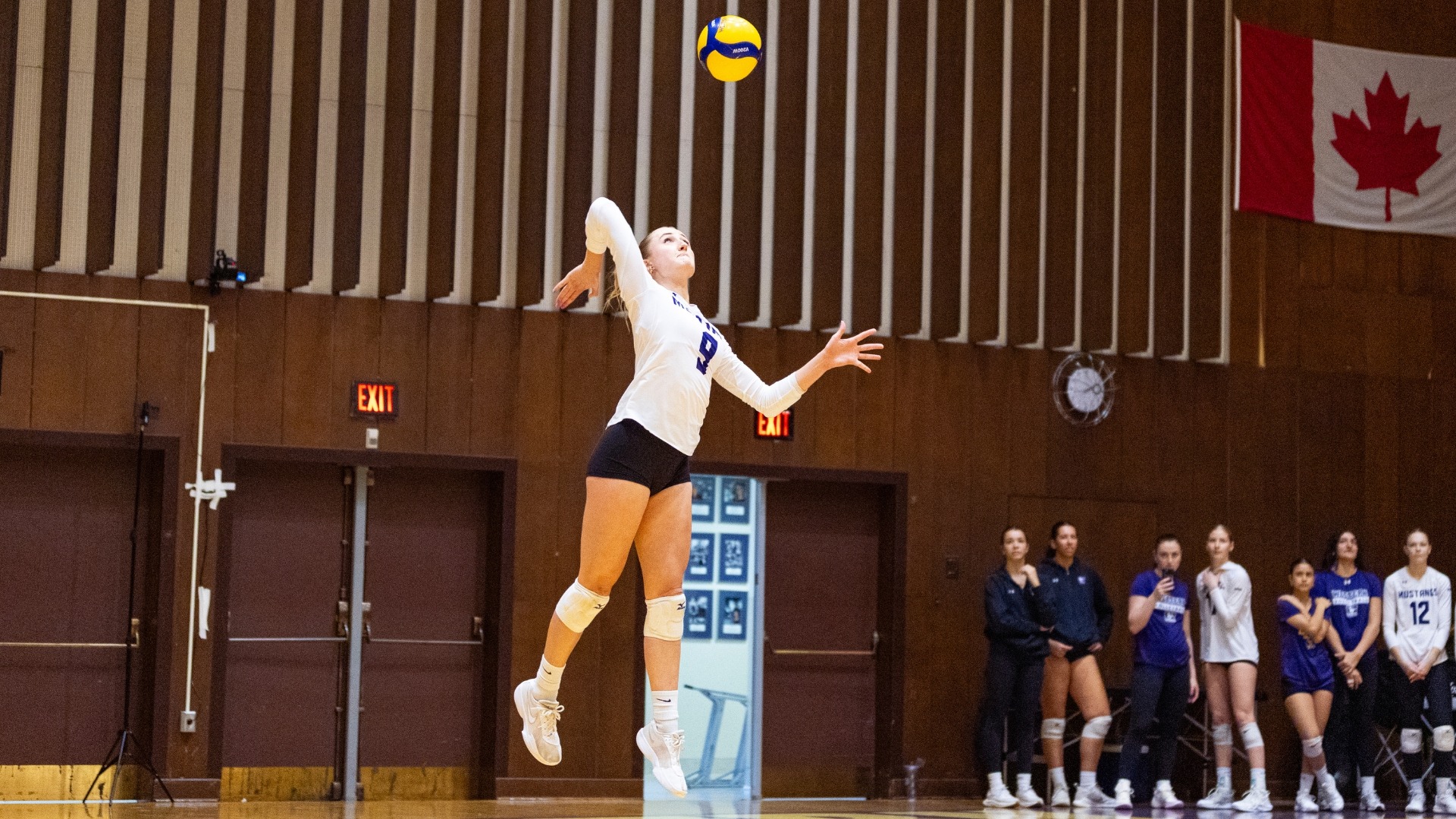 Nyla Tukker serves the ball against McMaster