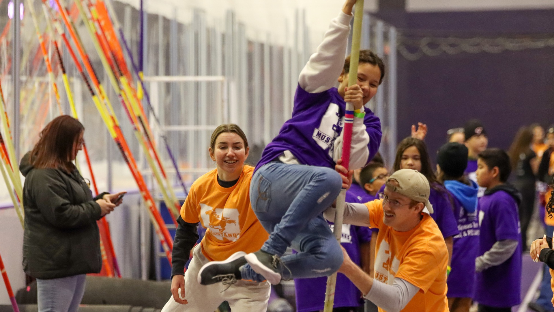 Indigenous Track & Field Day 2025: students jumping hurdles