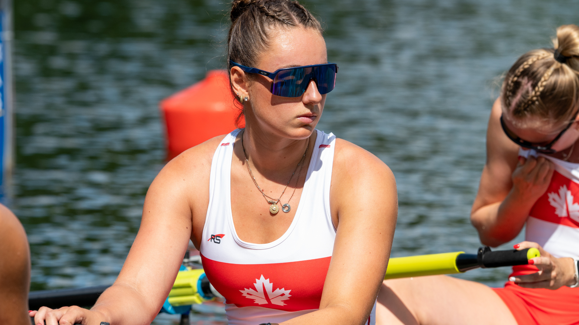 Olivia Calbeck in Canada gear rowing on the water