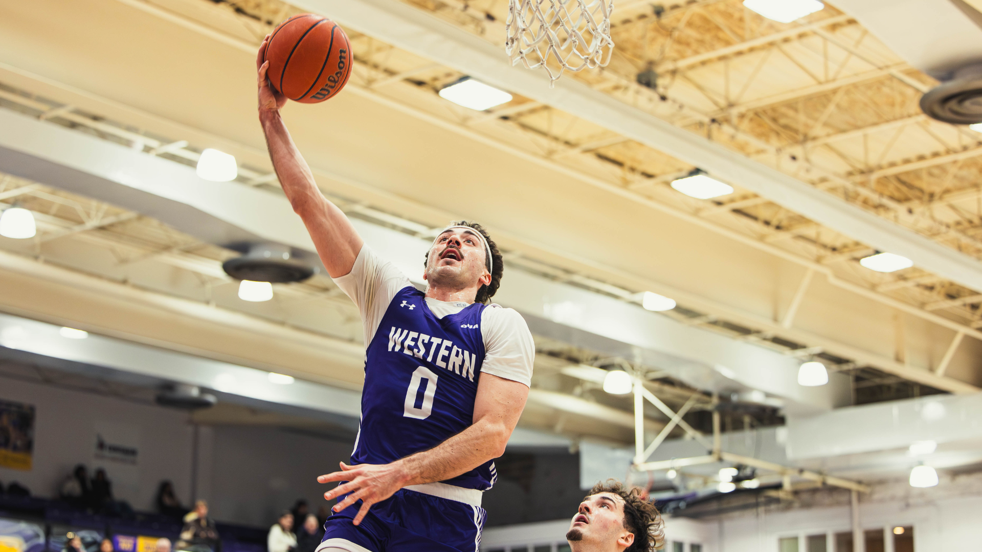 Matteo Zagar goes for a lay-up against Laurier