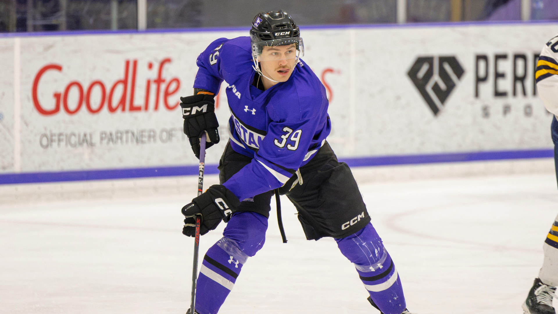 Lawson Sherk plays the puck against Windsor