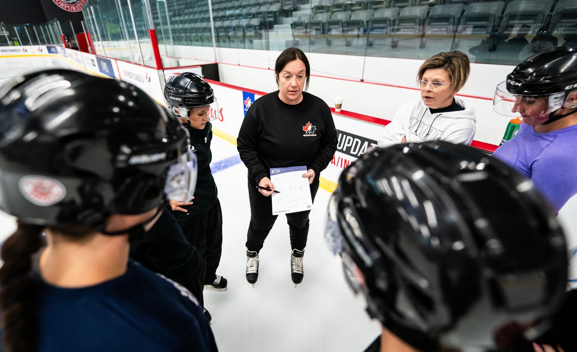 Group of hockey officials on the ice