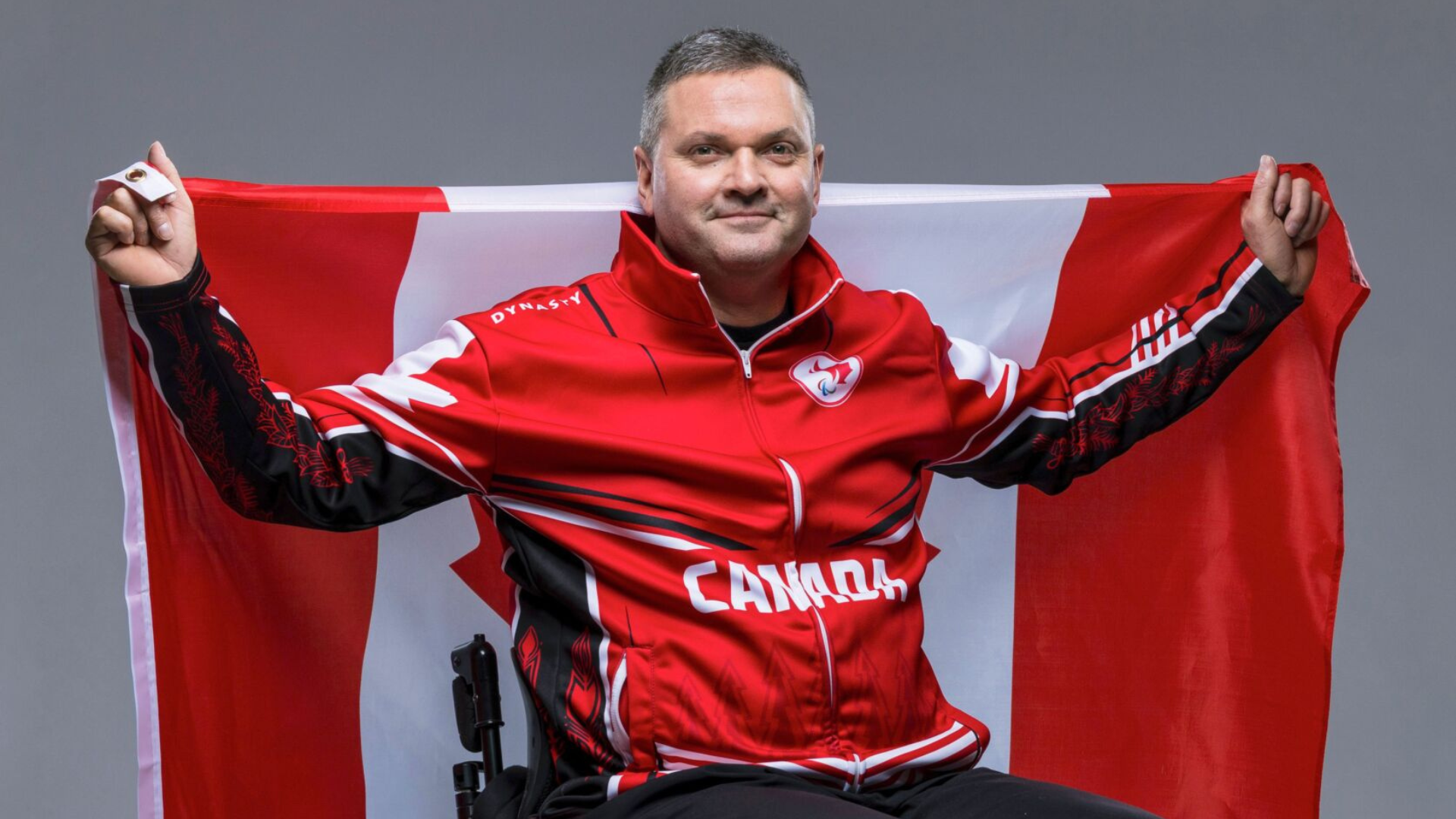 Ideson holds Canadian Flag