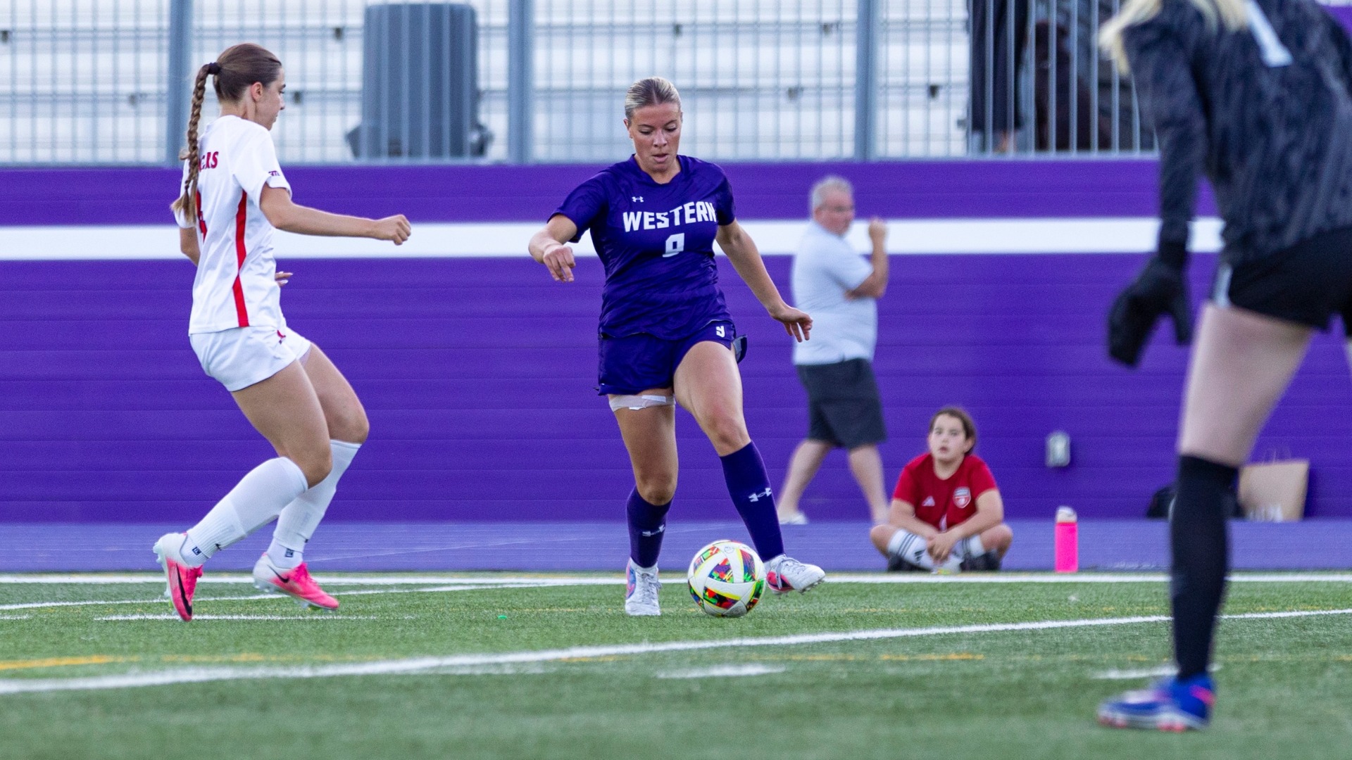 Miranda Preece plays the ball against Brock