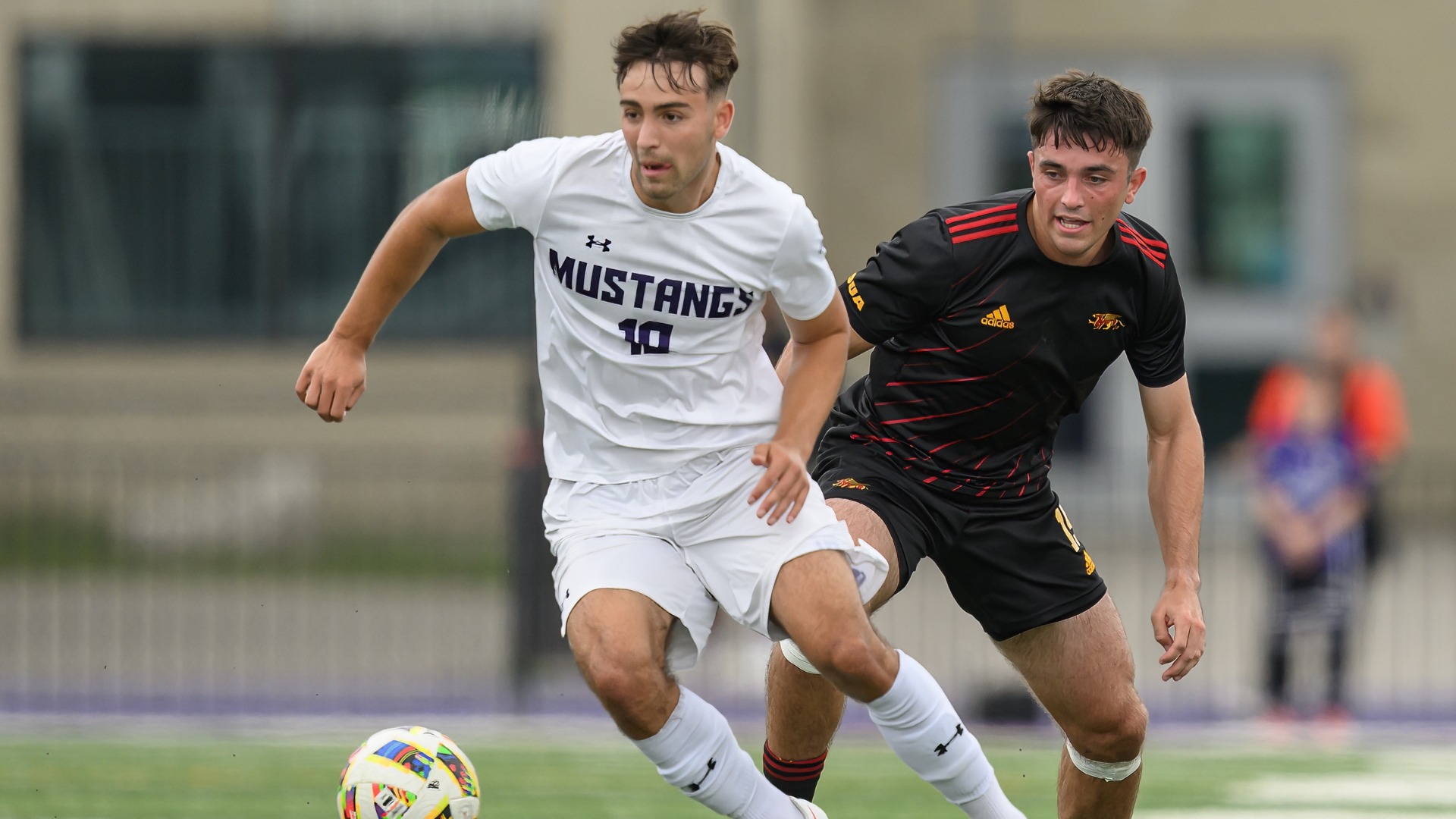 Panos Tzanetakis plays the ball against Guelph