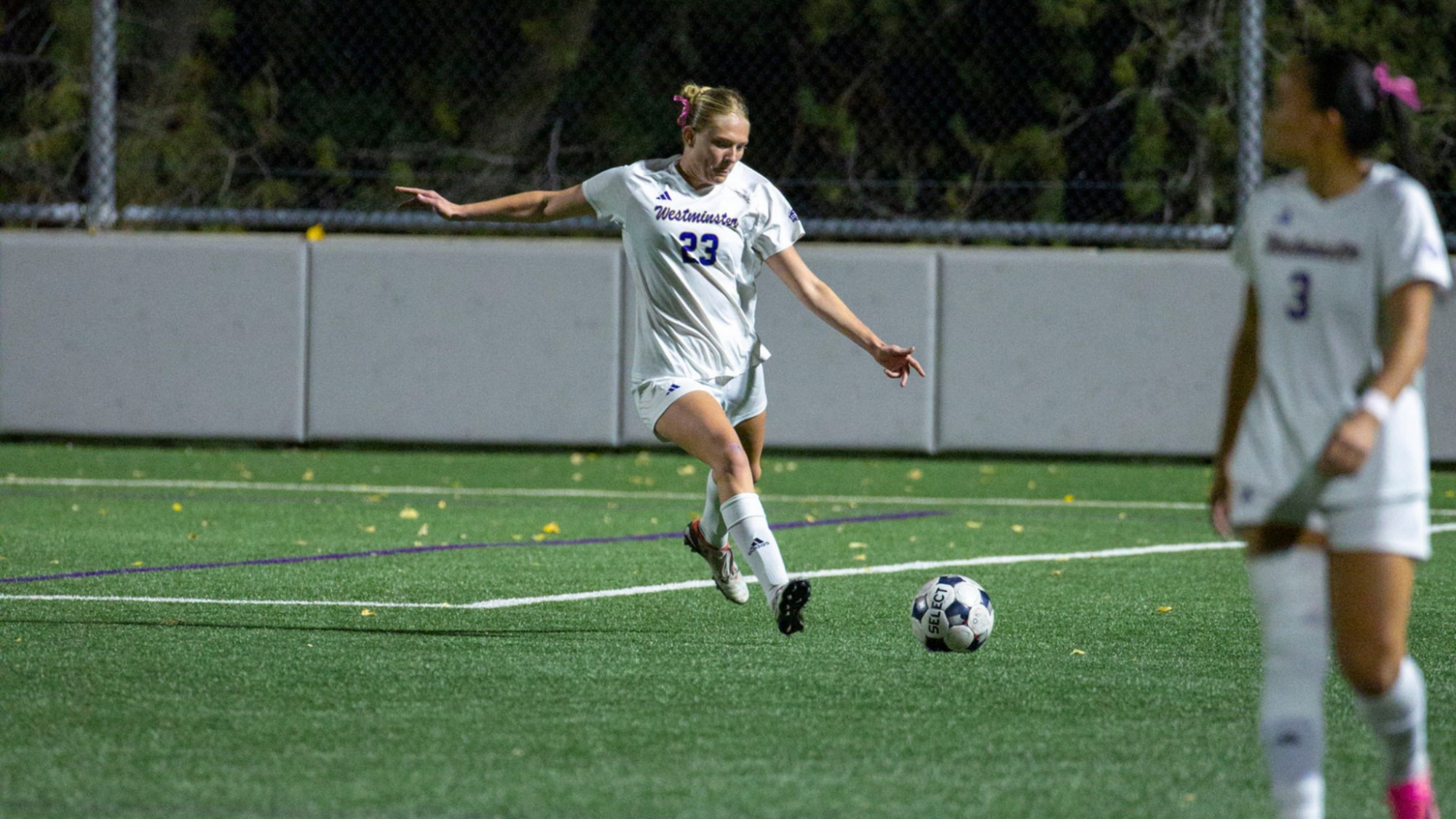 Addie Gibbons clearing the ball out of the defensive third
