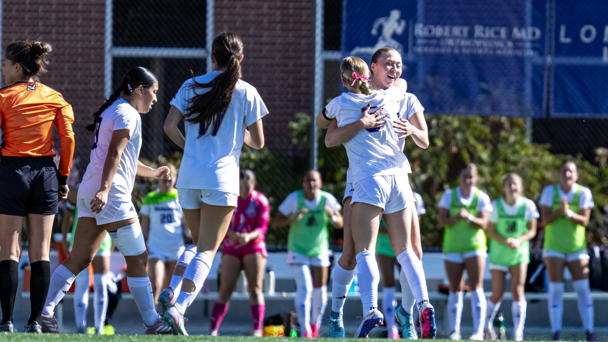 Women's Soccer team celebrating a goal