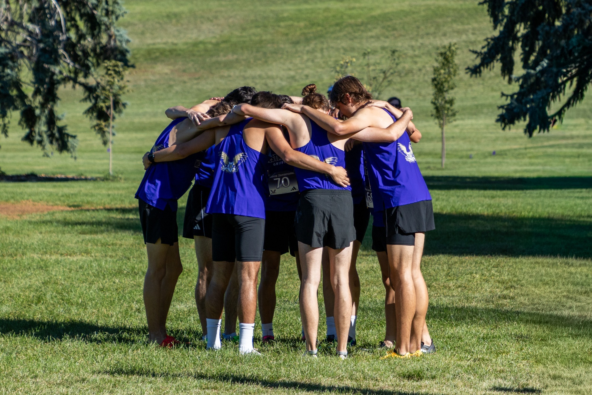 Cross Country Huddle at Beehive Invitational Meet