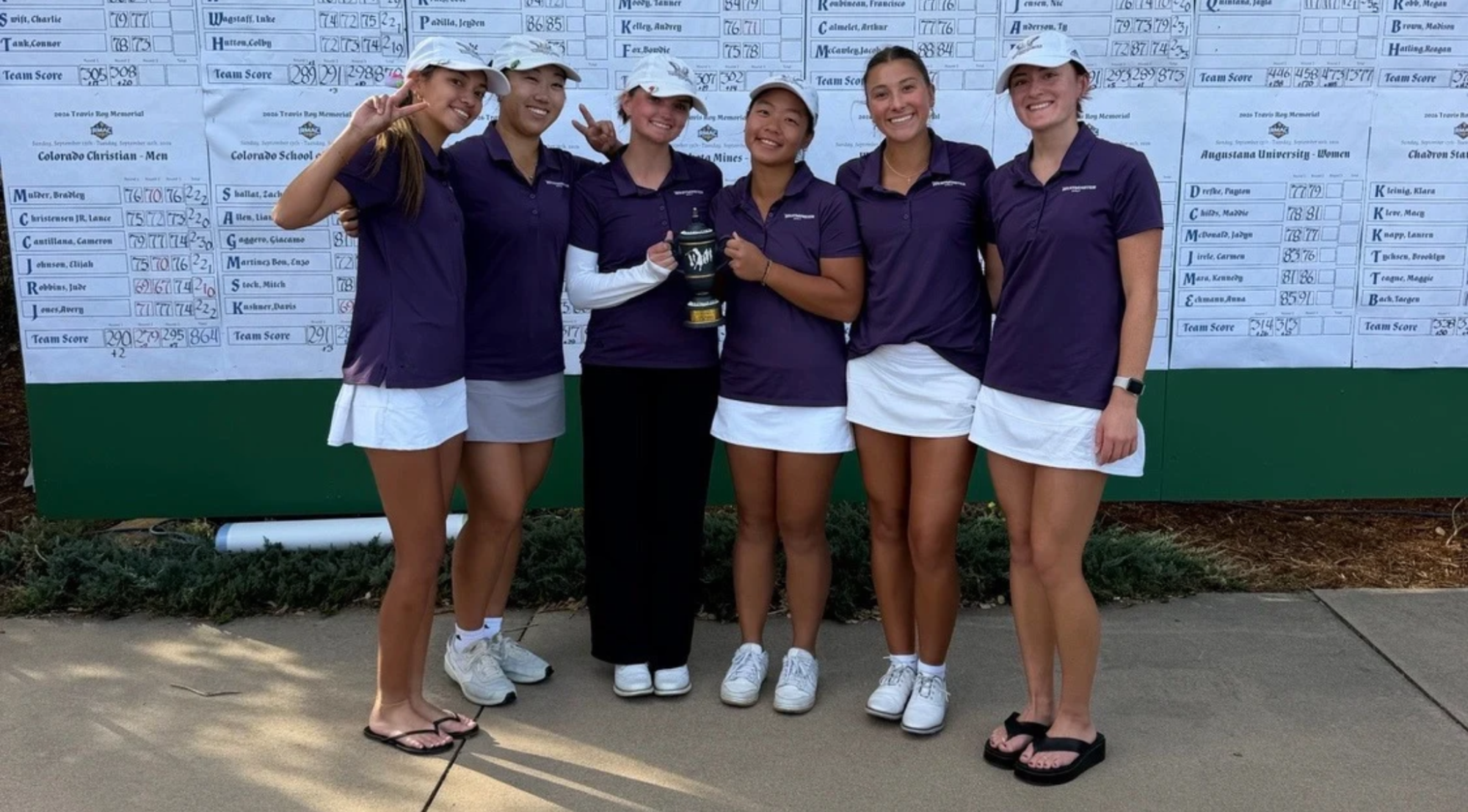 Women's golf posing following tournament