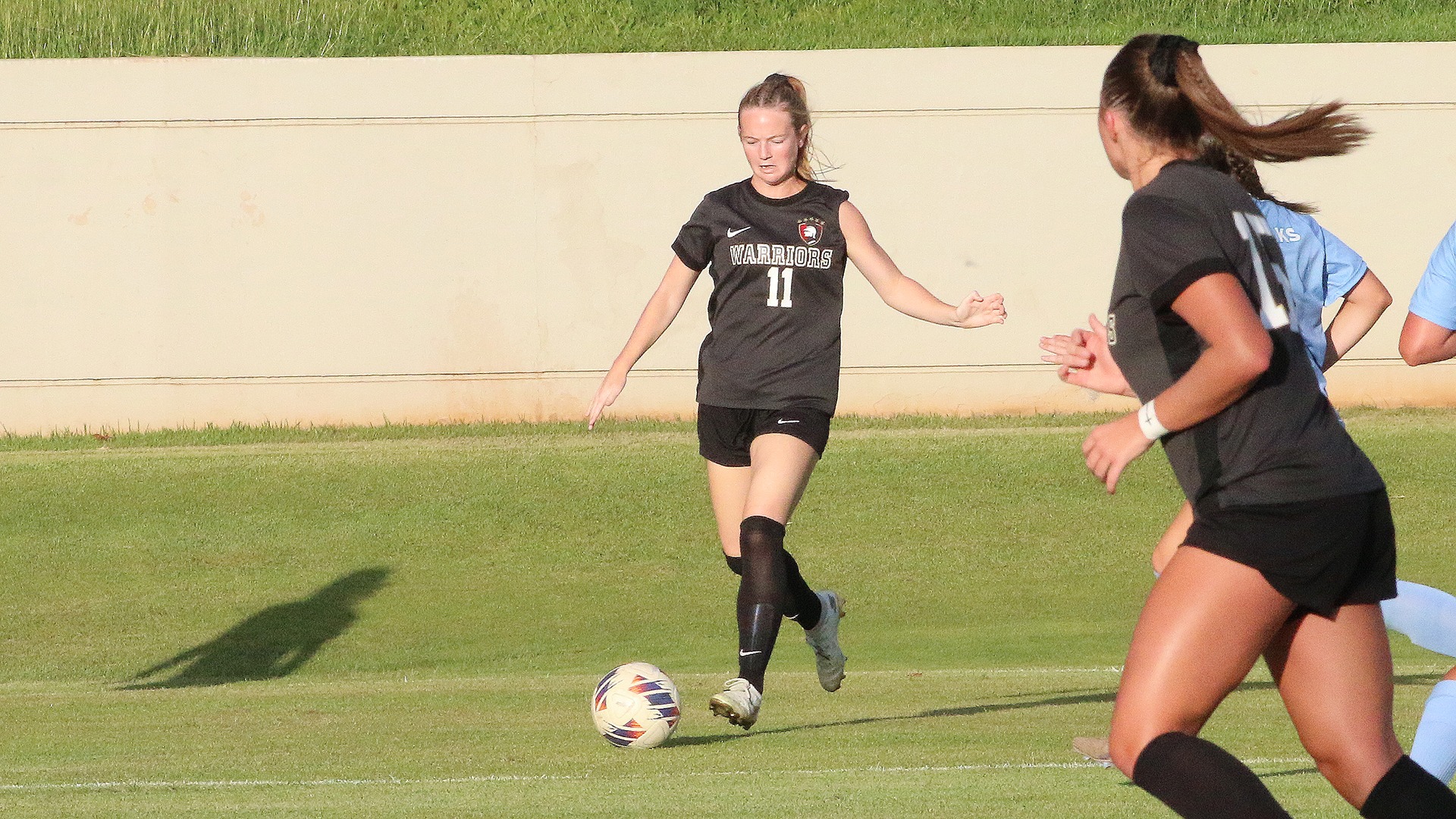 Madeline Steinbach Crossing the Ball to Sierra Martin (not pictured) for Westmont's first goal (Photo by Ron Smith)