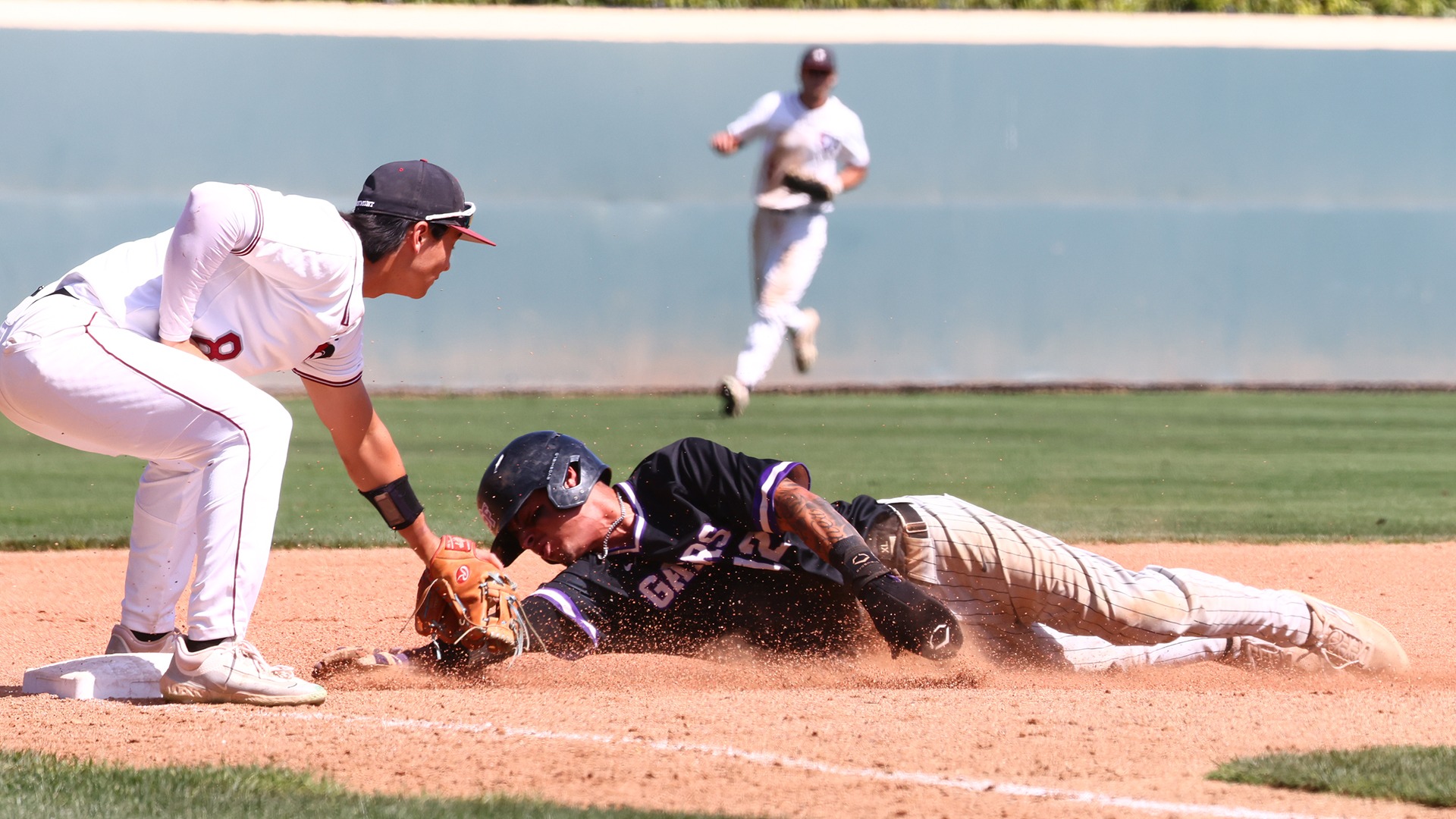 Daniel Patterson tags out a would-be base stealer (Photo by Brad Elliott)