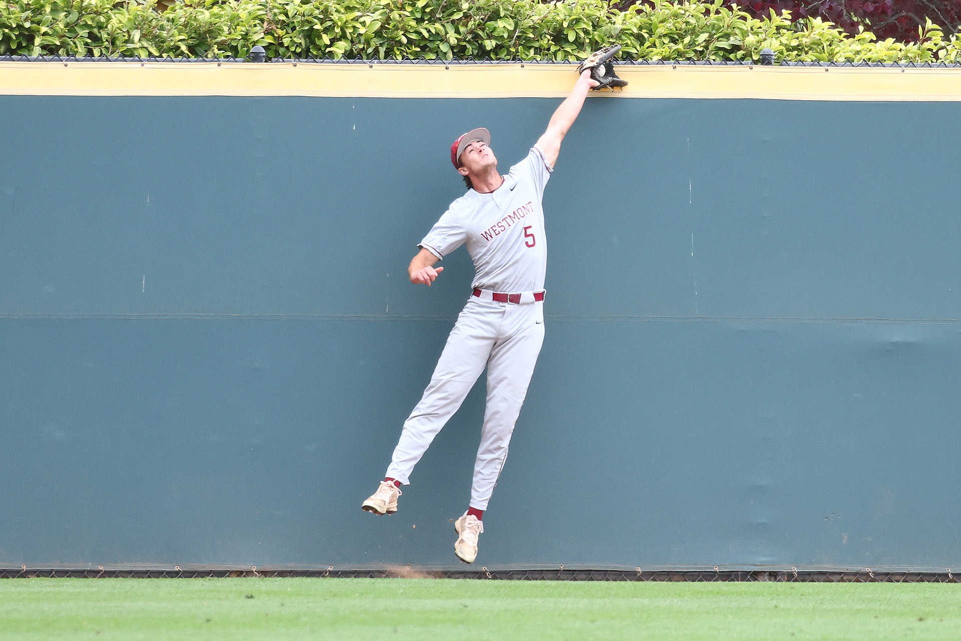 Trey Dunn robs a home run (Photo by Brad Elliott)